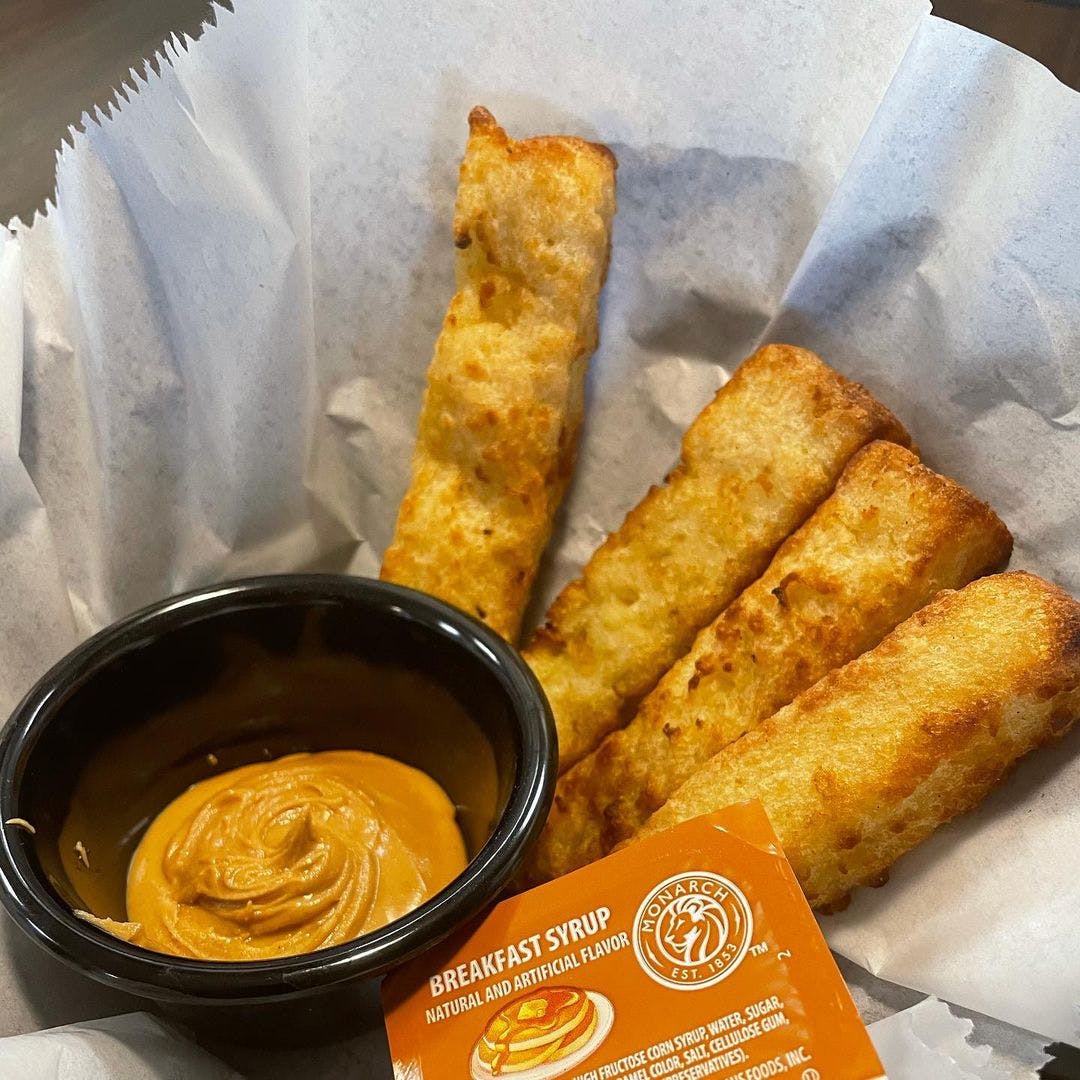 Order French Toast Sticks - Appetizer food online from Billy Jack Pizza Pub store, Kearney on bringmethat.com