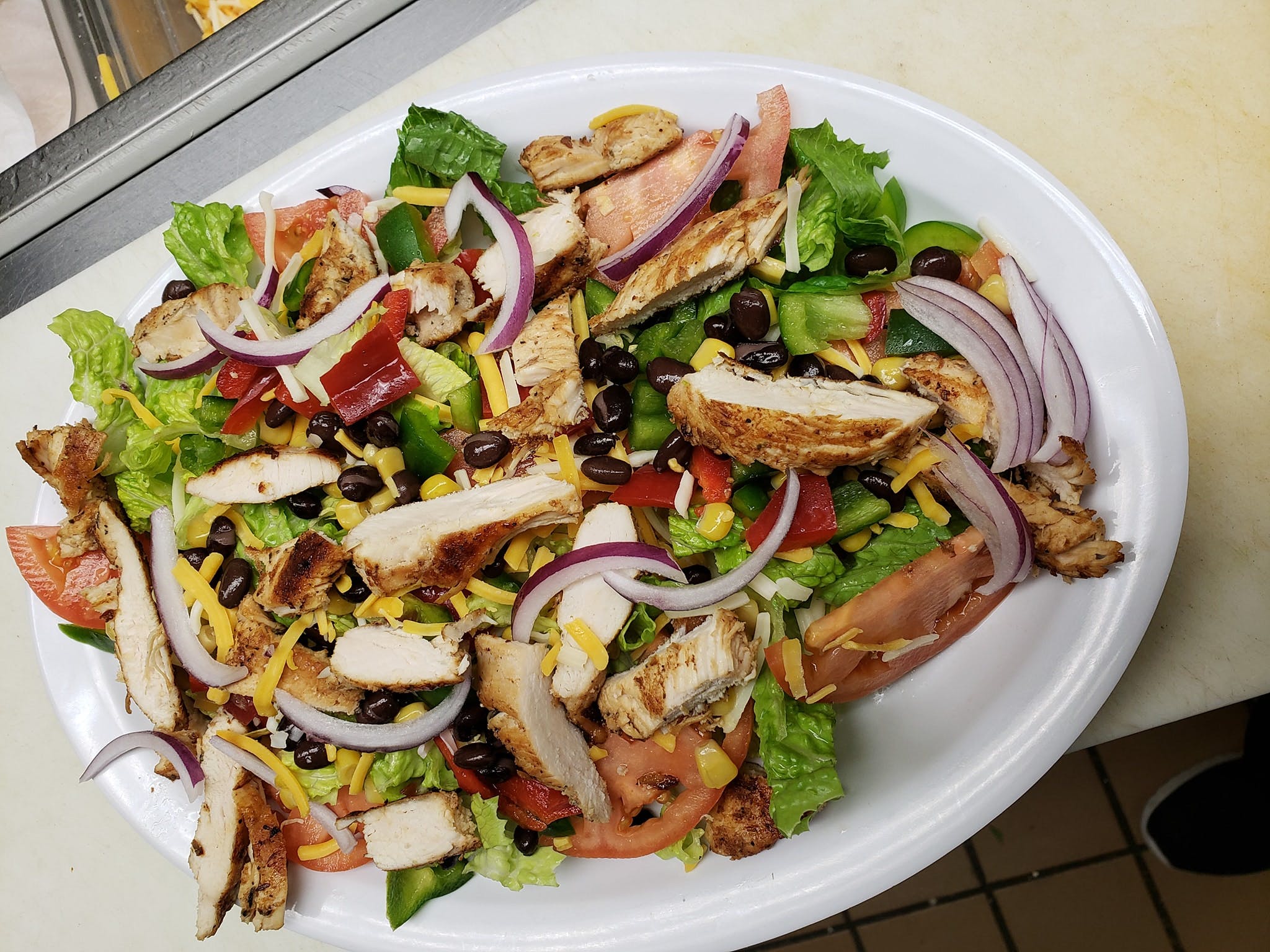 Order Grilled Chicken Salad - Salad food online from Roma Breakfast & Pizzeria store, Columbia on bringmethat.com