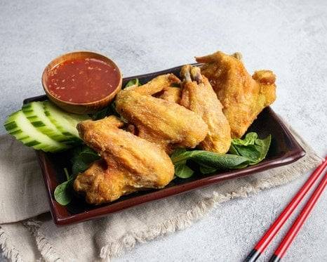 Order Tamarind Wings food online from What The Cluck store, San Francisco on bringmethat.com