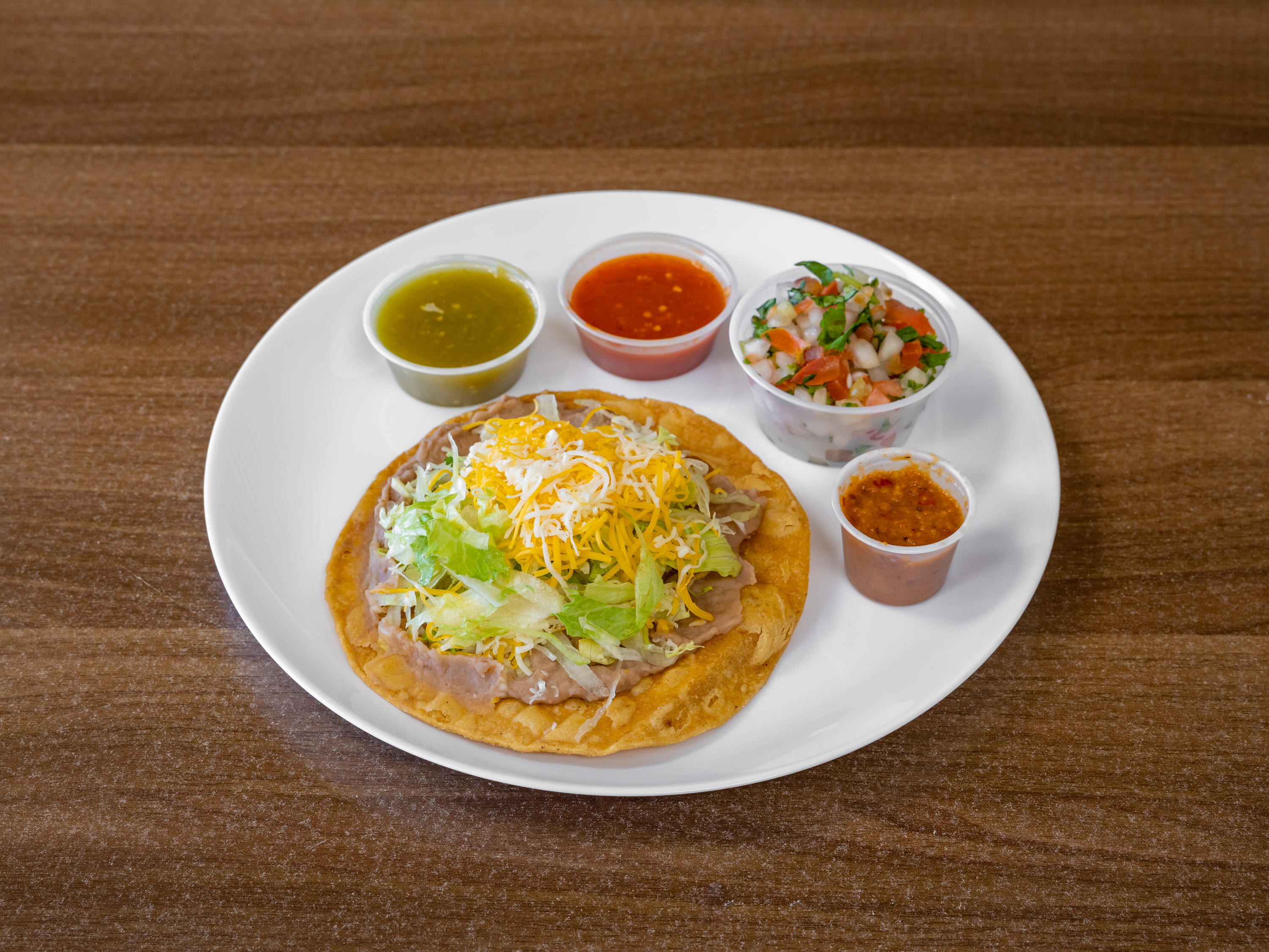 Order Beans Tostada food online from Albertacos Mexican Food store, Orange on bringmethat.com