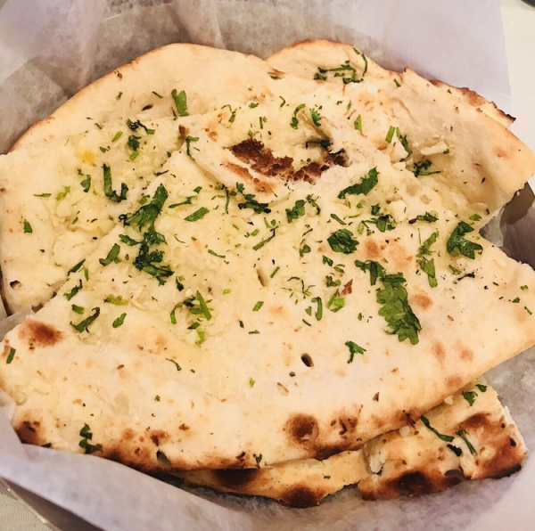 Order Garlic Naan food online from Royal India Bistro store, Lexington on bringmethat.com
