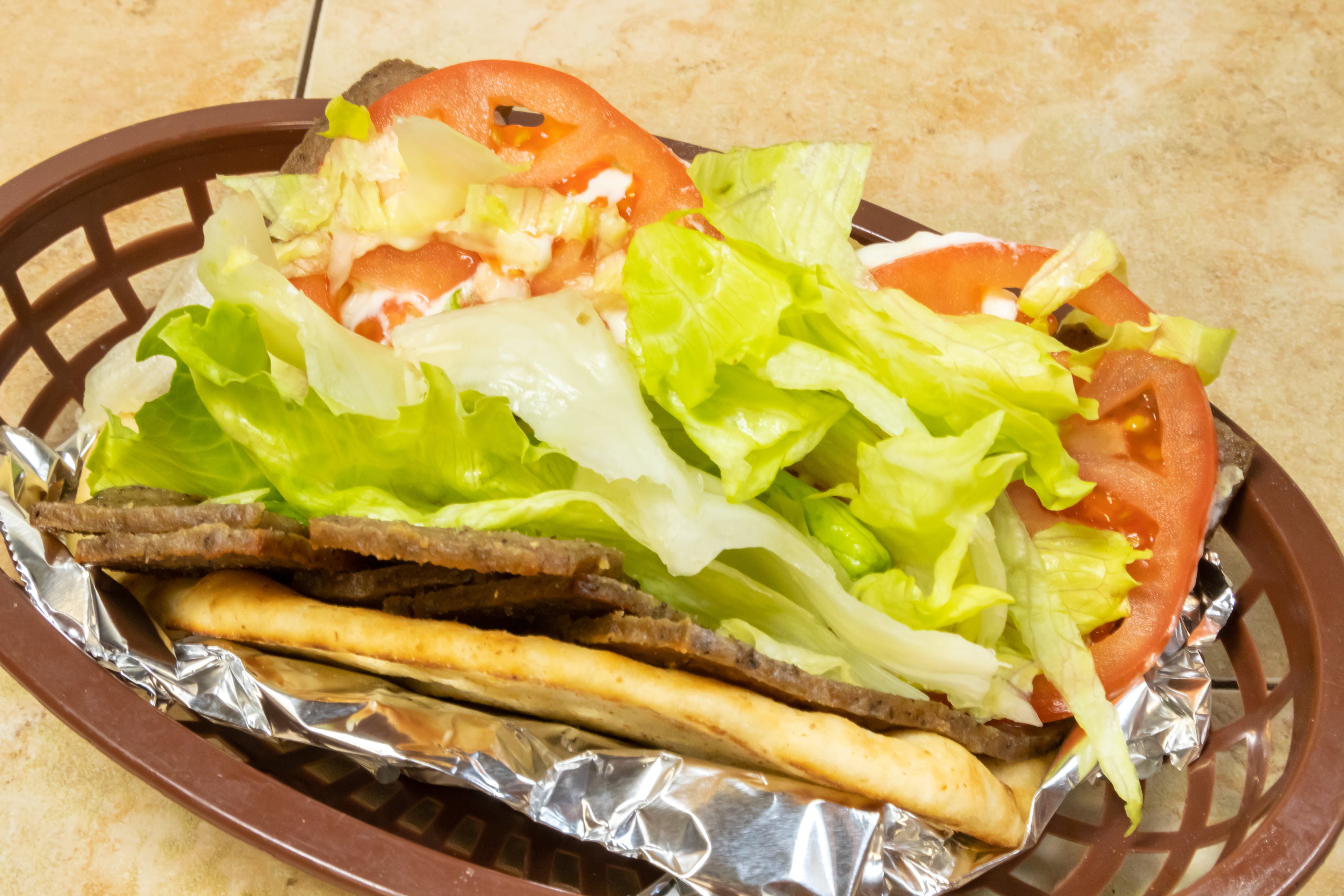 Order Lamb Gyro - Gyro food online from Novotny's Groceries & Pizza store, Worthington on bringmethat.com