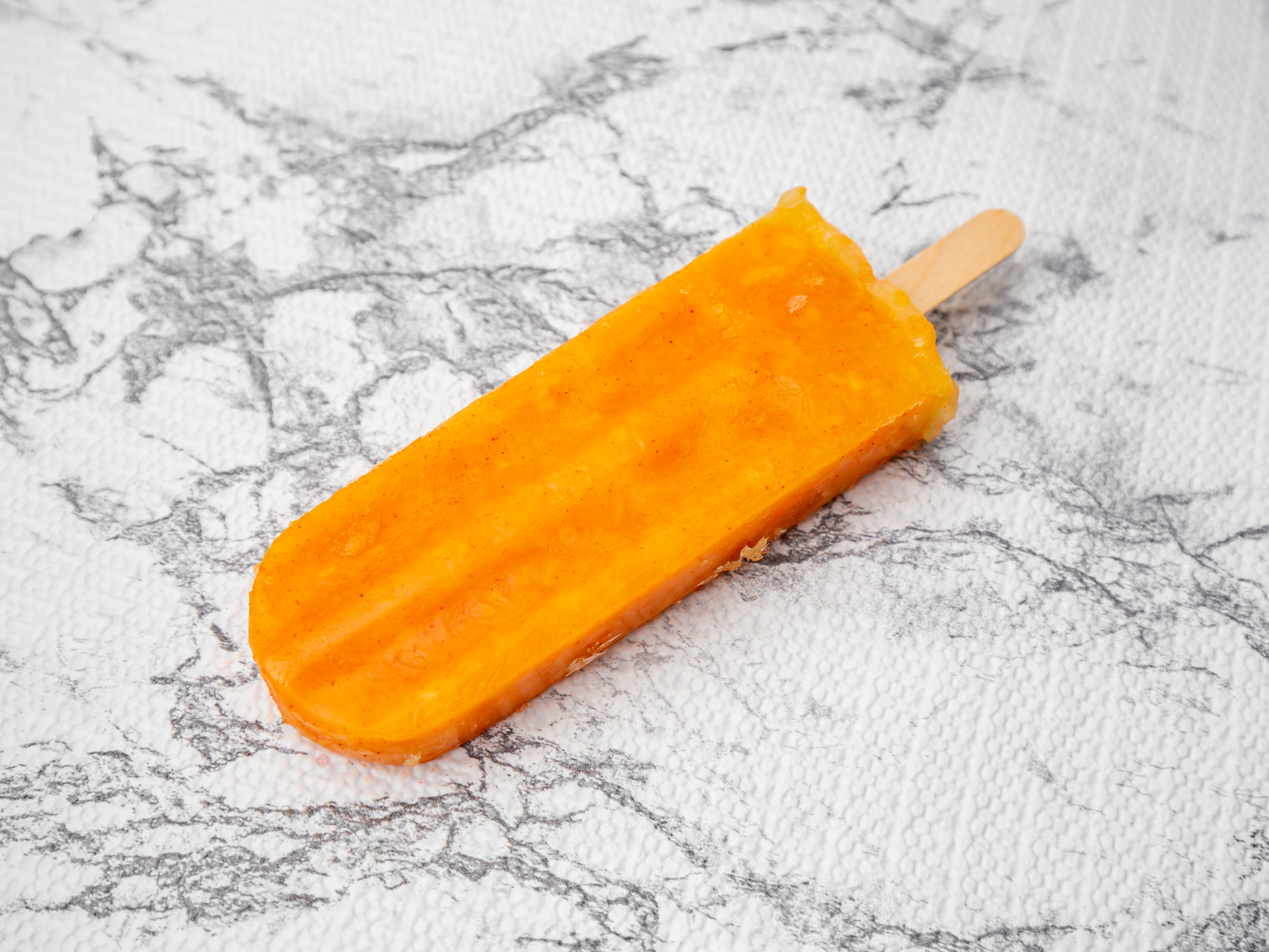 Order Mango with Chile Paletas food online from Ome Calli store, Beaverton on bringmethat.com