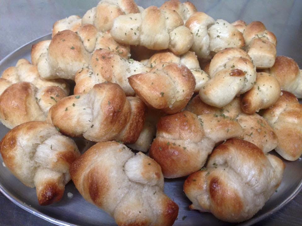 Order Garlic Knots - 4 Pieces food online from Mario Cafe & Pizzeria store, East Greenville on bringmethat.com
