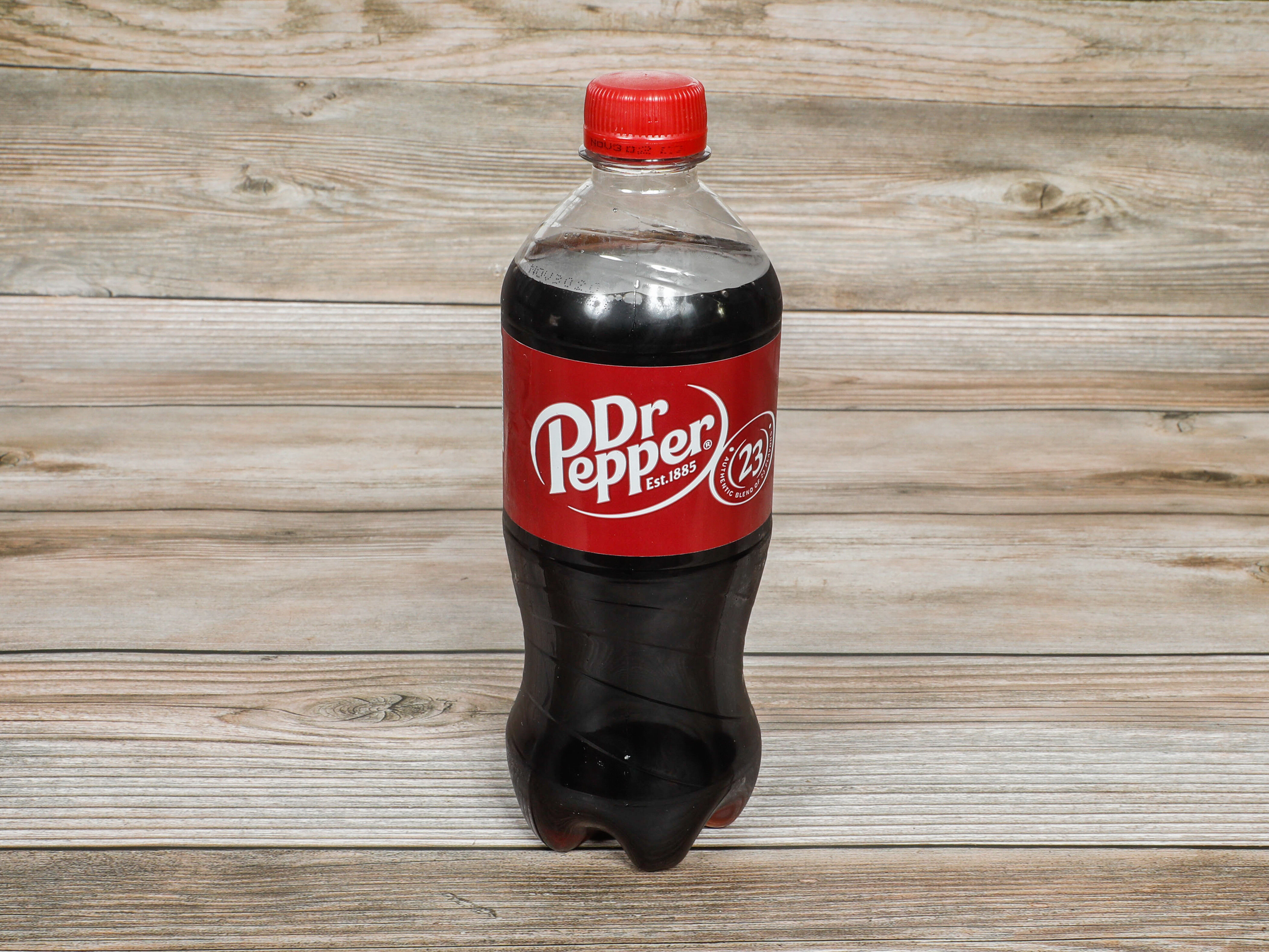 Order Dr Pepper Soda 20 oz. food online from Amigos Halal Market store, Daly City on bringmethat.com