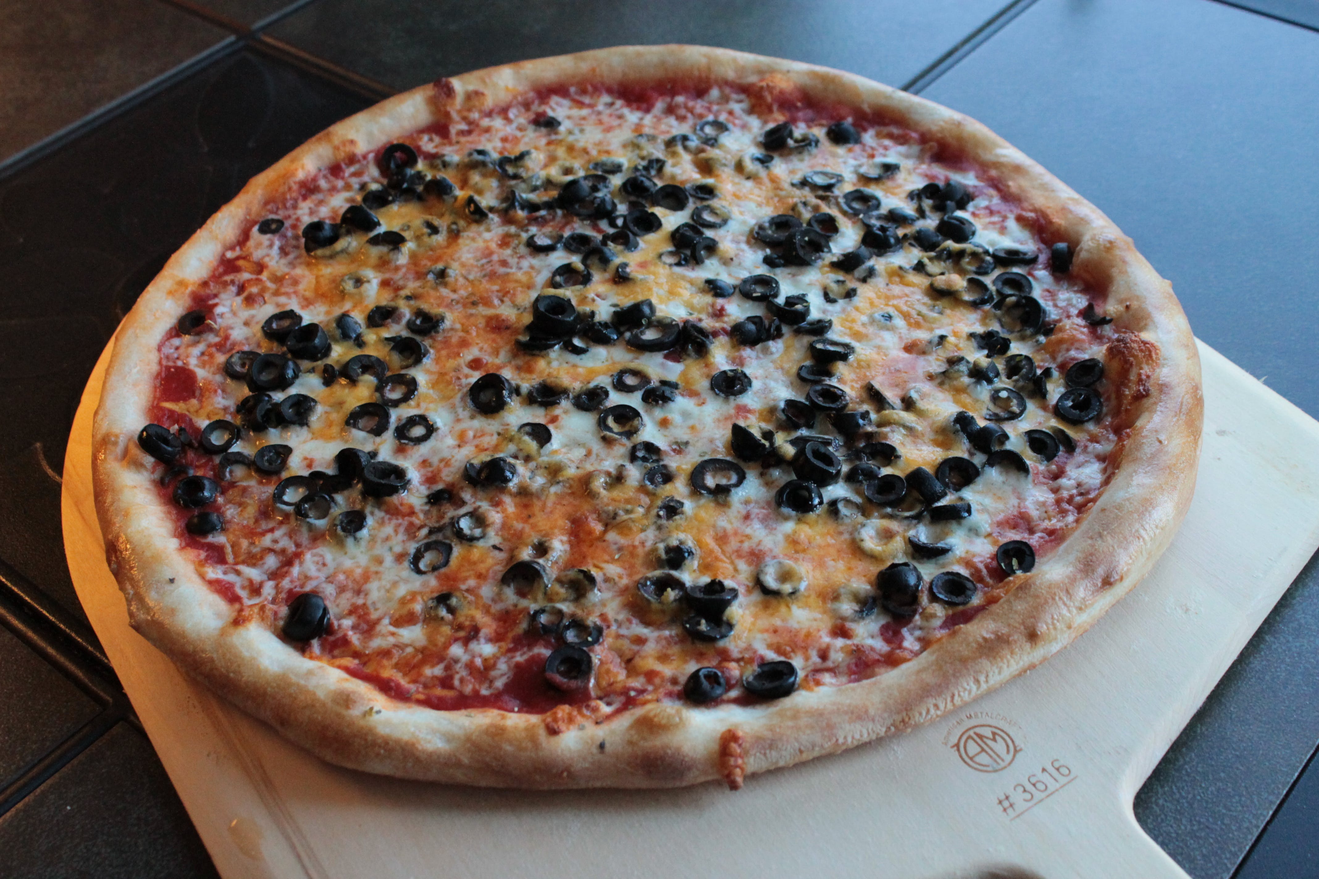 Order Black & Gold Pizza - Medium 14" food online from The Dough Boy's Pizzeria store, Baldwinsville on bringmethat.com