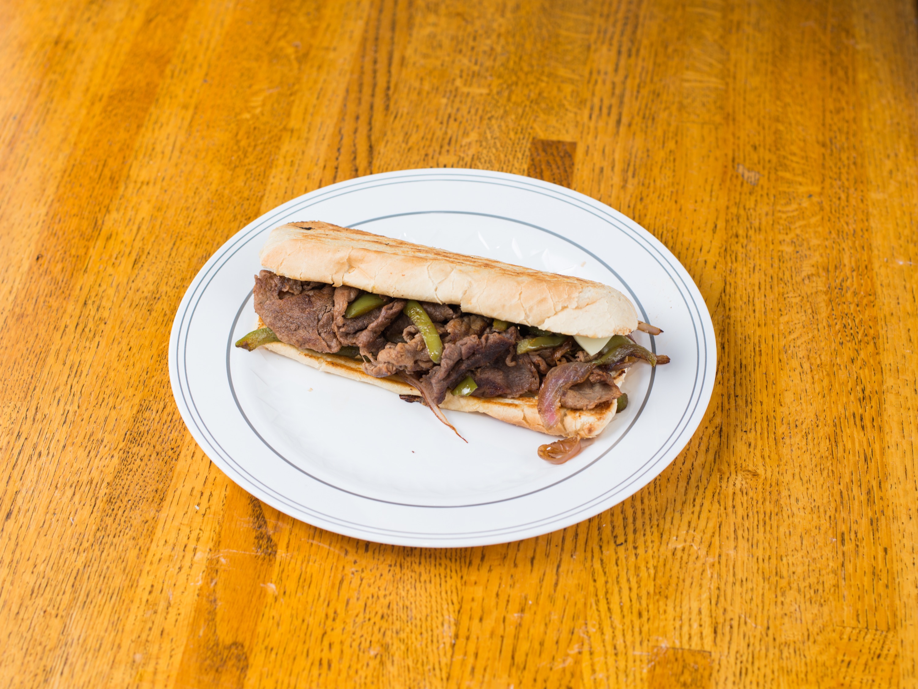 Order Philly Steak Sandwich food online from Russell's Barbecue store, Elmwood Park on bringmethat.com