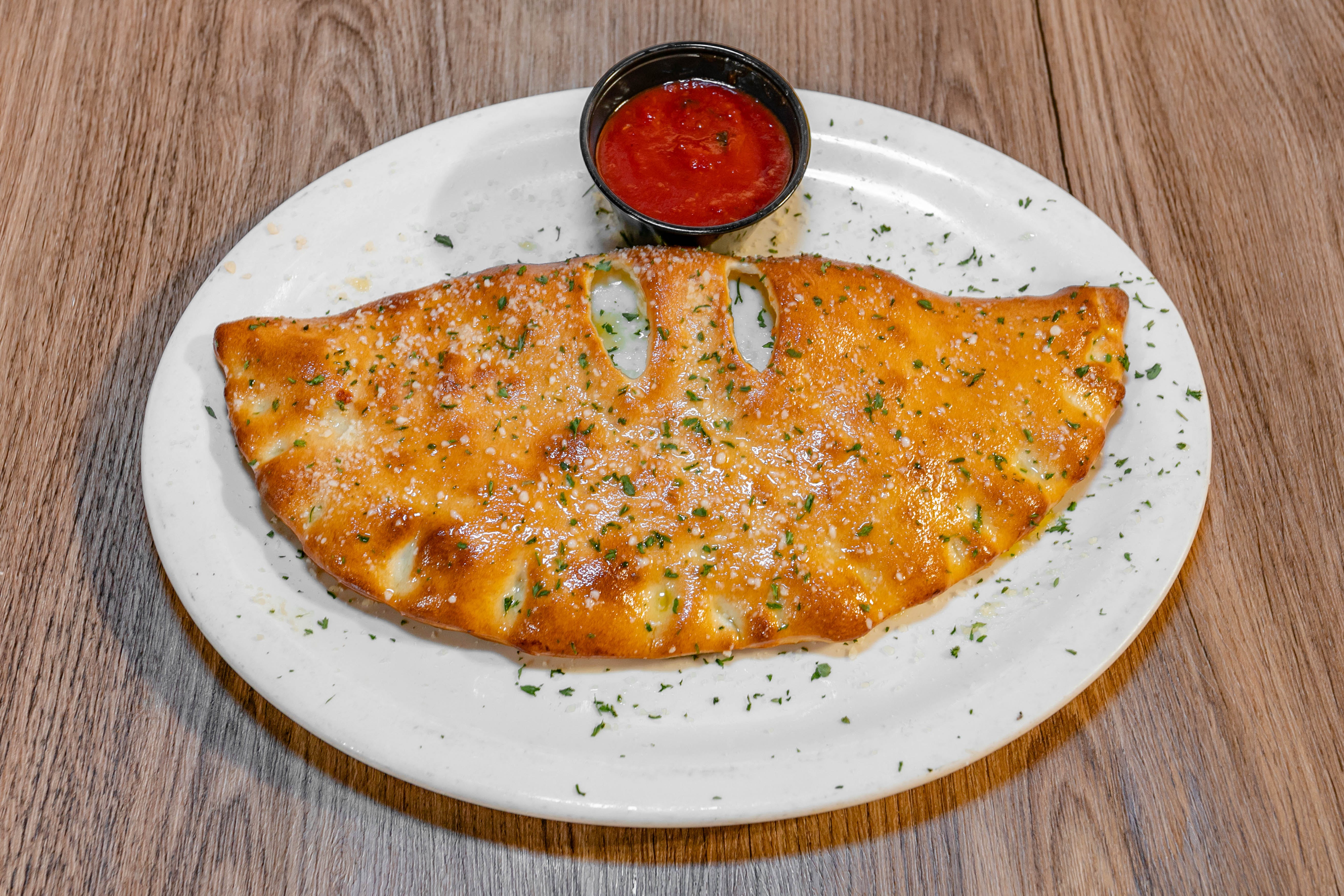Order Cheese Calzone - Calzone food online from Sopranos Grill store, Braselton on bringmethat.com