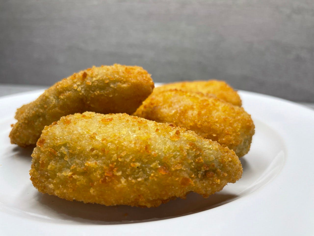 Order Jalapeno Poppers - Appetizer food online from Troys Italian Kitchen store, Arlington on bringmethat.com