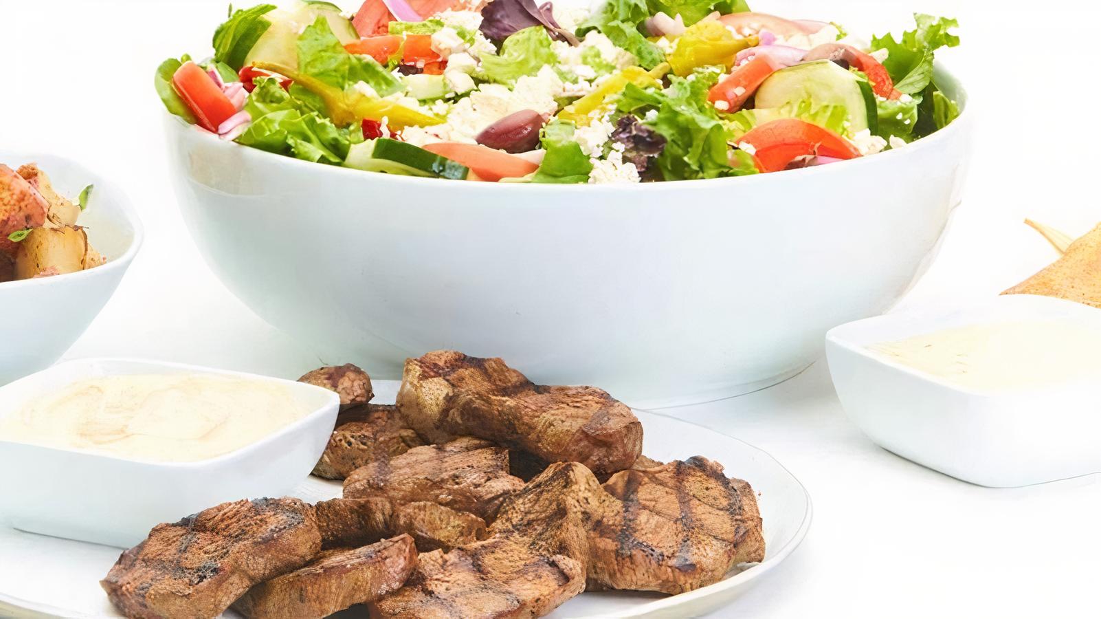 Order Grilled Beef Family Feast for 6 food online from Taziki Mediterranean Cafe store, Alpharetta on bringmethat.com
