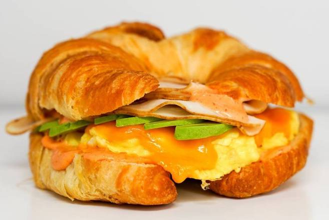 Order Croissant Smoked Turkey, Egg, and Avocado Sandwich food online from Sunday Best Breakfast Sandwiches store, View Park-Windsor Hills on bringmethat.com