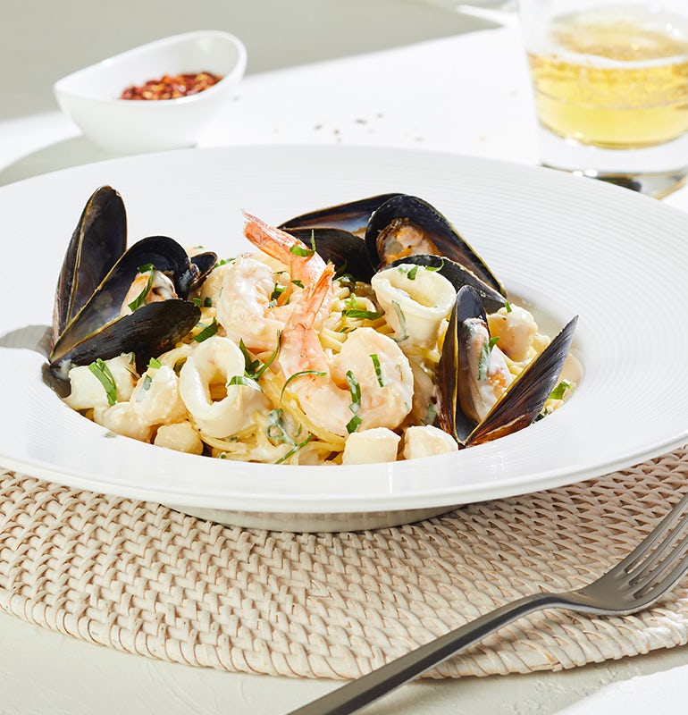 Order GARLIC BUTTER SEAFOOD LINGUINI FINI food online from California Pizza Kitchen store, Norcross on bringmethat.com