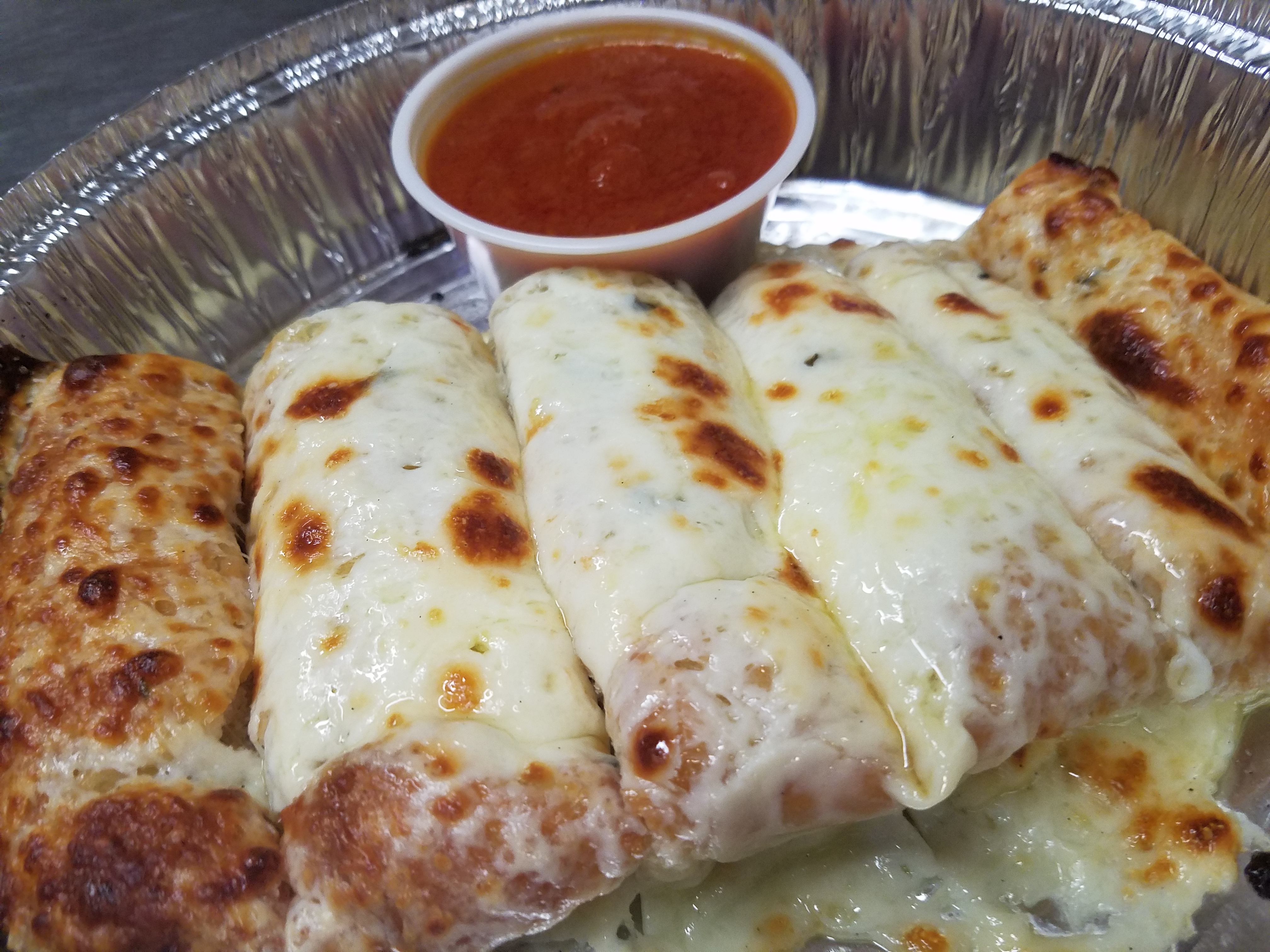 Order 6 Piece Cheesy Breadsticks food online from Vespa's Pizza store, Essex on bringmethat.com