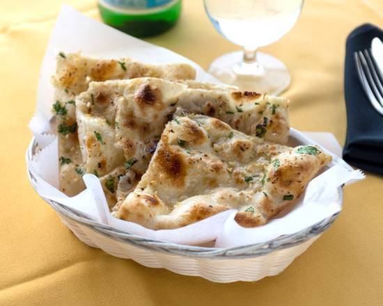 Order Garlic Naan food online from Saffron Indian Kitchen store, Ambler on bringmethat.com