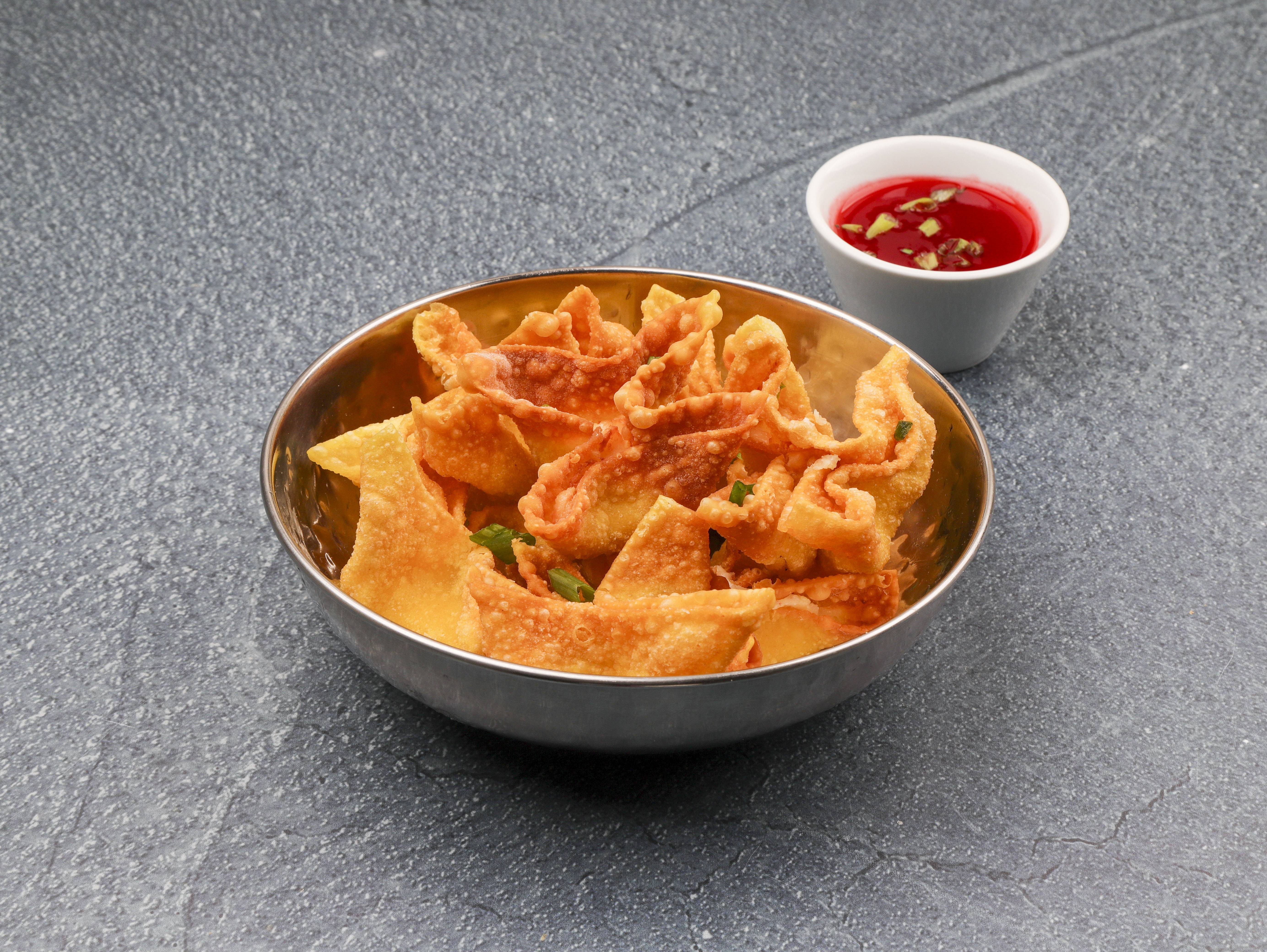 Order 4. Crab Rangoon food online from New China store, St. Louis on bringmethat.com
