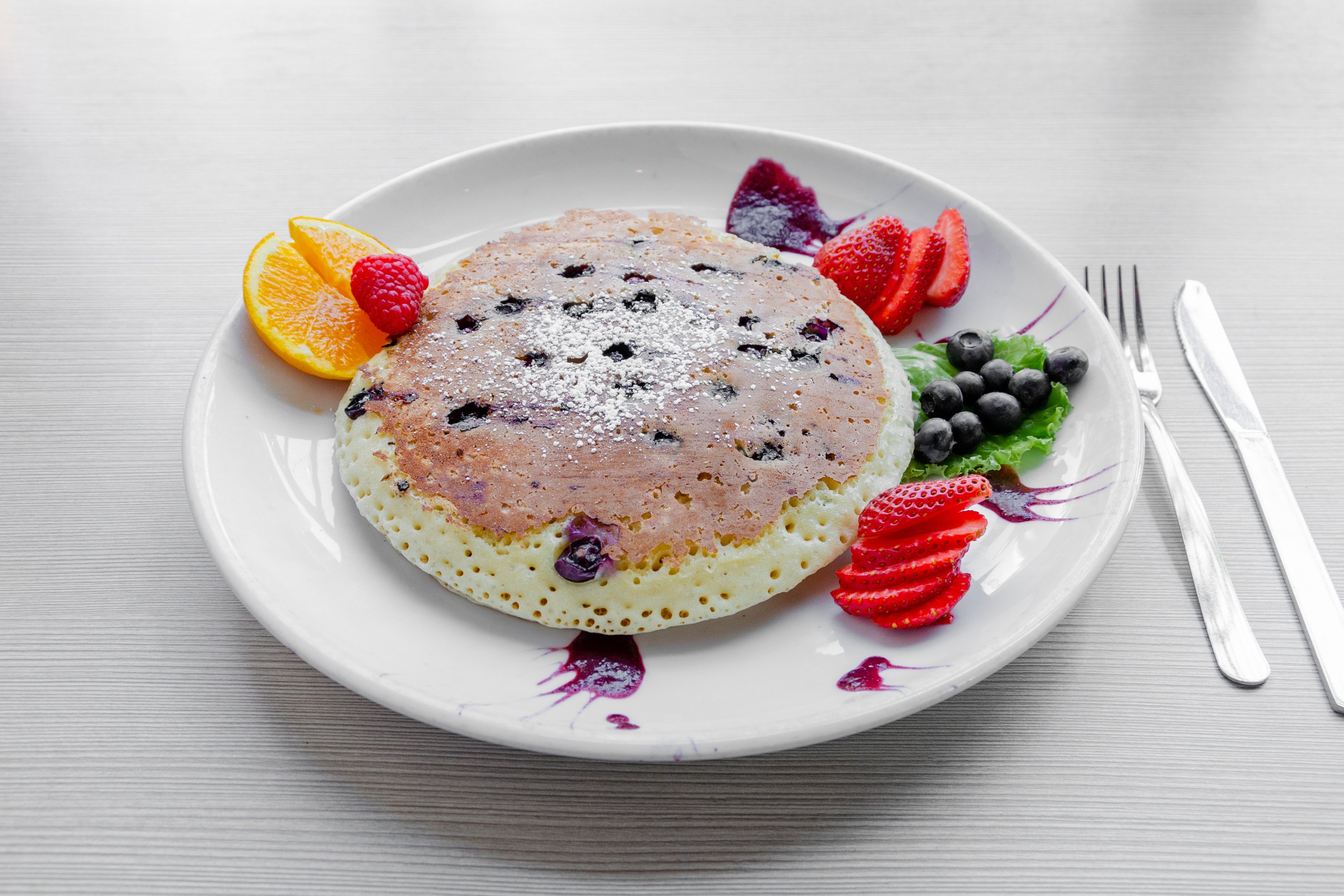 Order Blueberry Pancakes* food online from Swami Cafe store, San Diego on bringmethat.com
