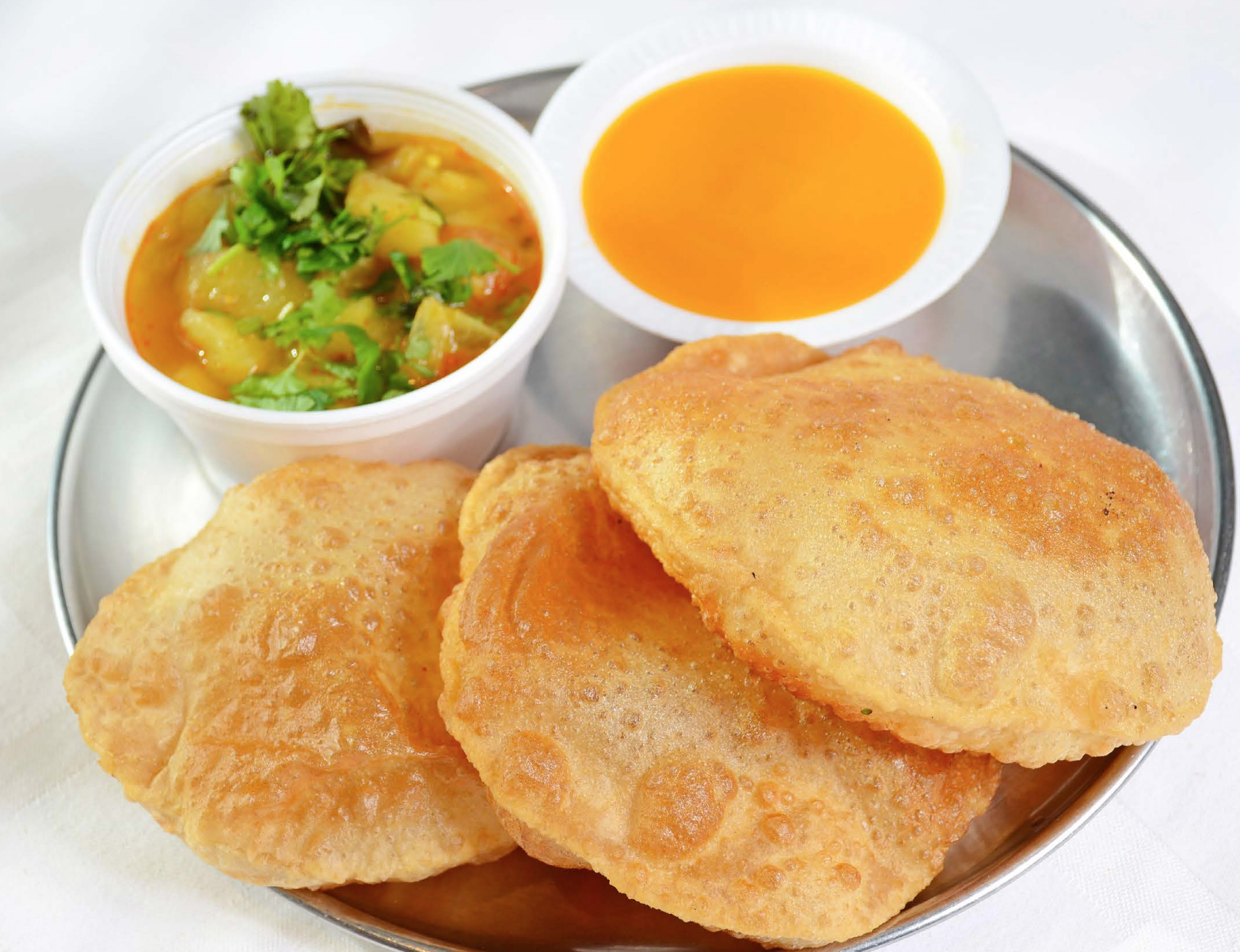 Order Mango Ras Puri with Sabji food online from Shri Balaji Bhavan store, Houston on bringmethat.com