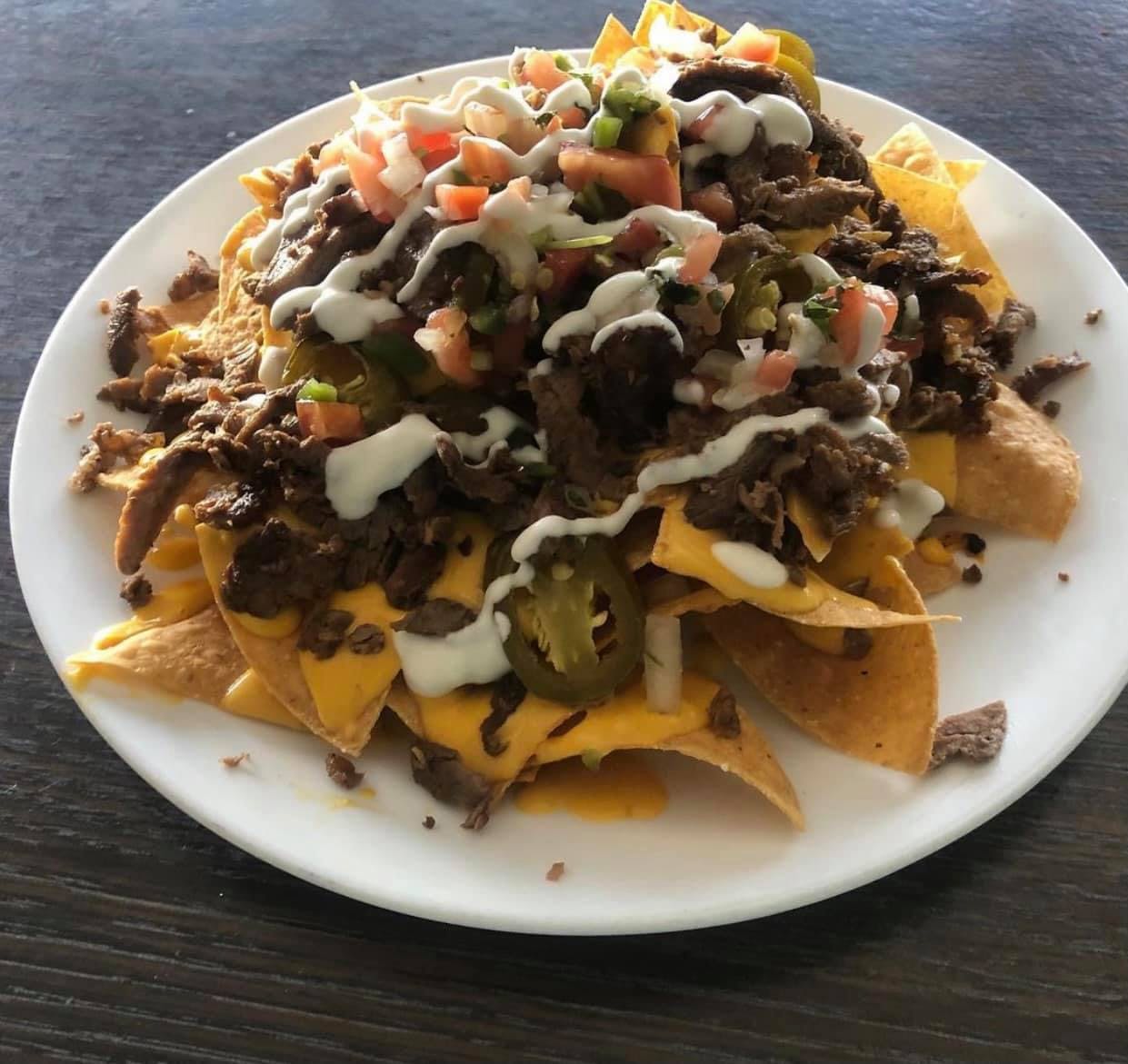 Order Asada Nachos - Small food online from Andy Pizzeria store, Los Angeles on bringmethat.com