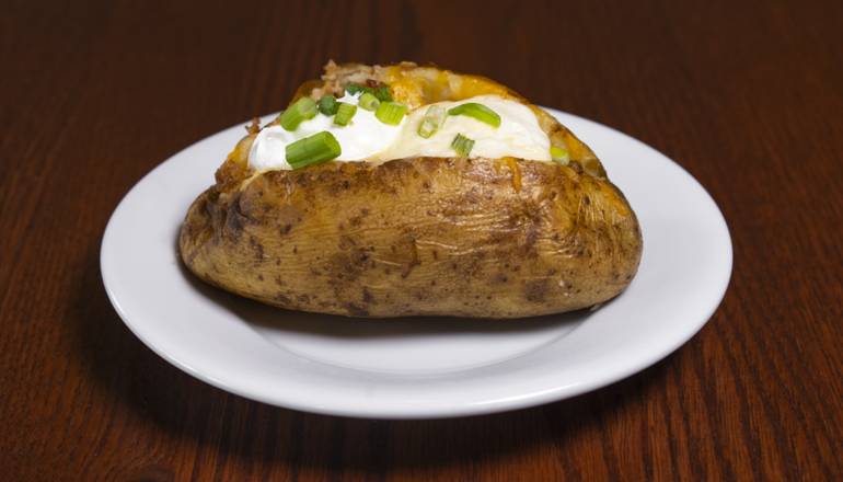 Order Loaded Baked Potato food online from Smokey Bones store, Chattanooga on bringmethat.com