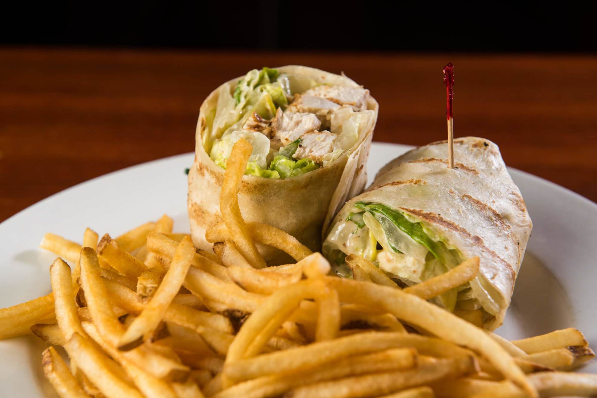 Order Chicken Caesar Wrap food online from The Vine Tavern & Eatery store, Tempe on bringmethat.com