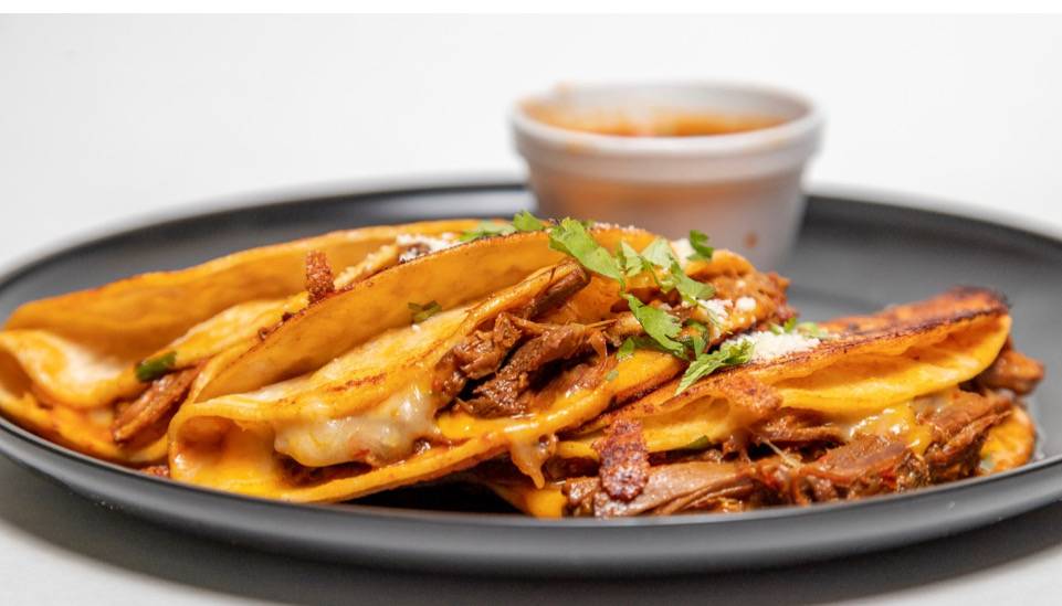 Order Birria tacos  food online from KMPizza&Grill store, Lawrence on bringmethat.com