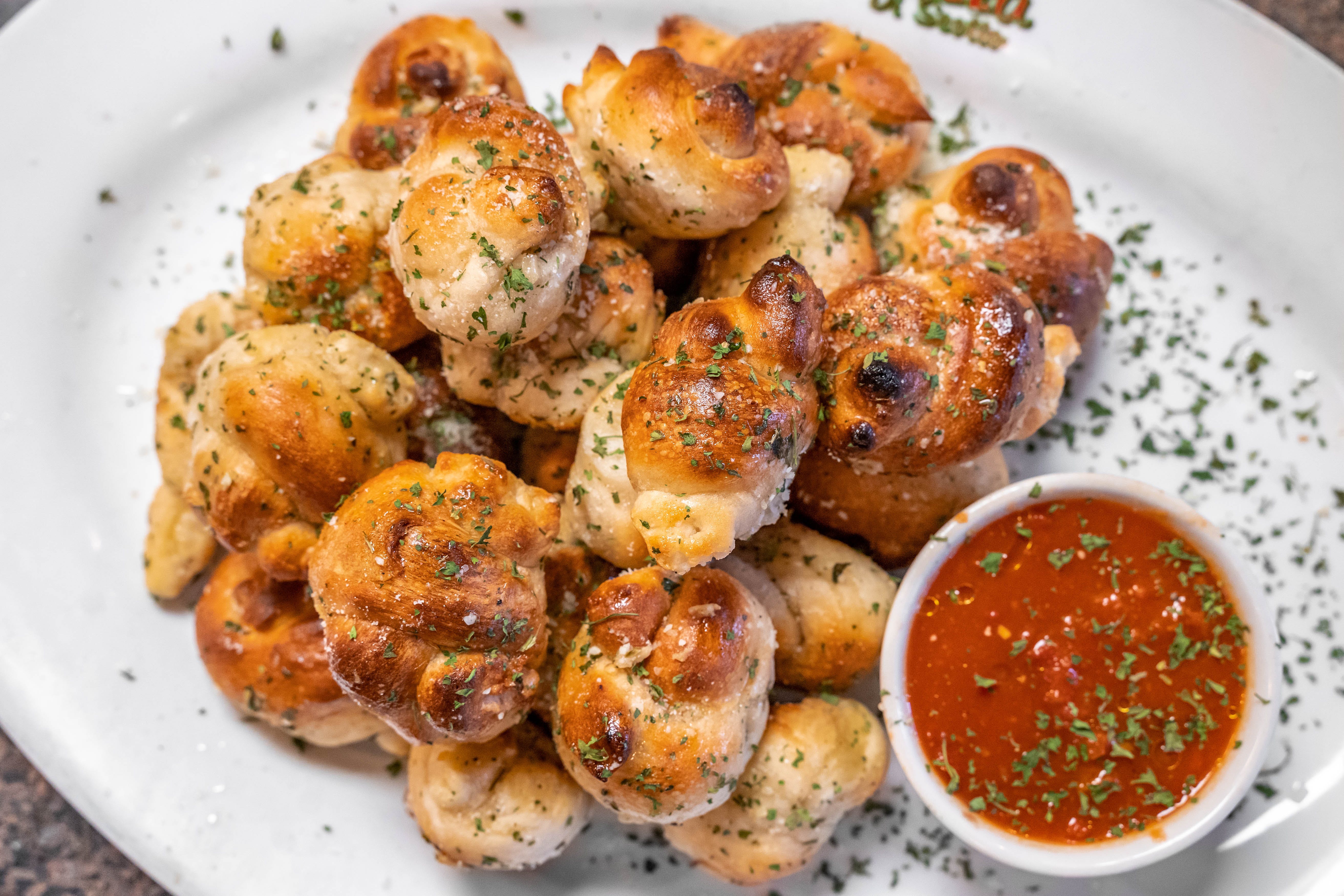 Order Garlic Knots - 4 Pieces food online from Father & Sons store, Woodbury on bringmethat.com