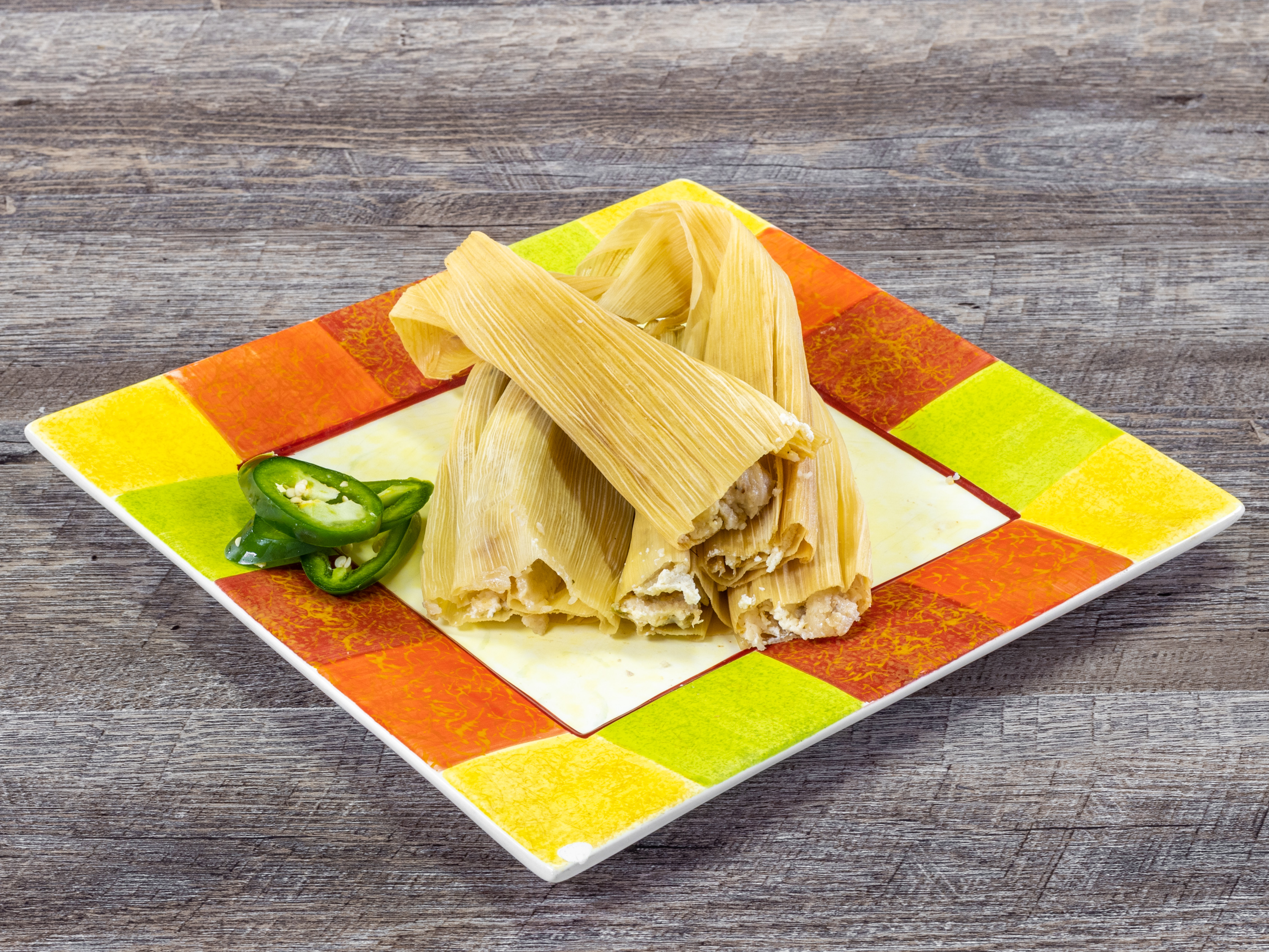 Order Spicy Tomatillo Chicken and Cheese Tamale  food online from Delicious Tamales store, San Antonio on bringmethat.com