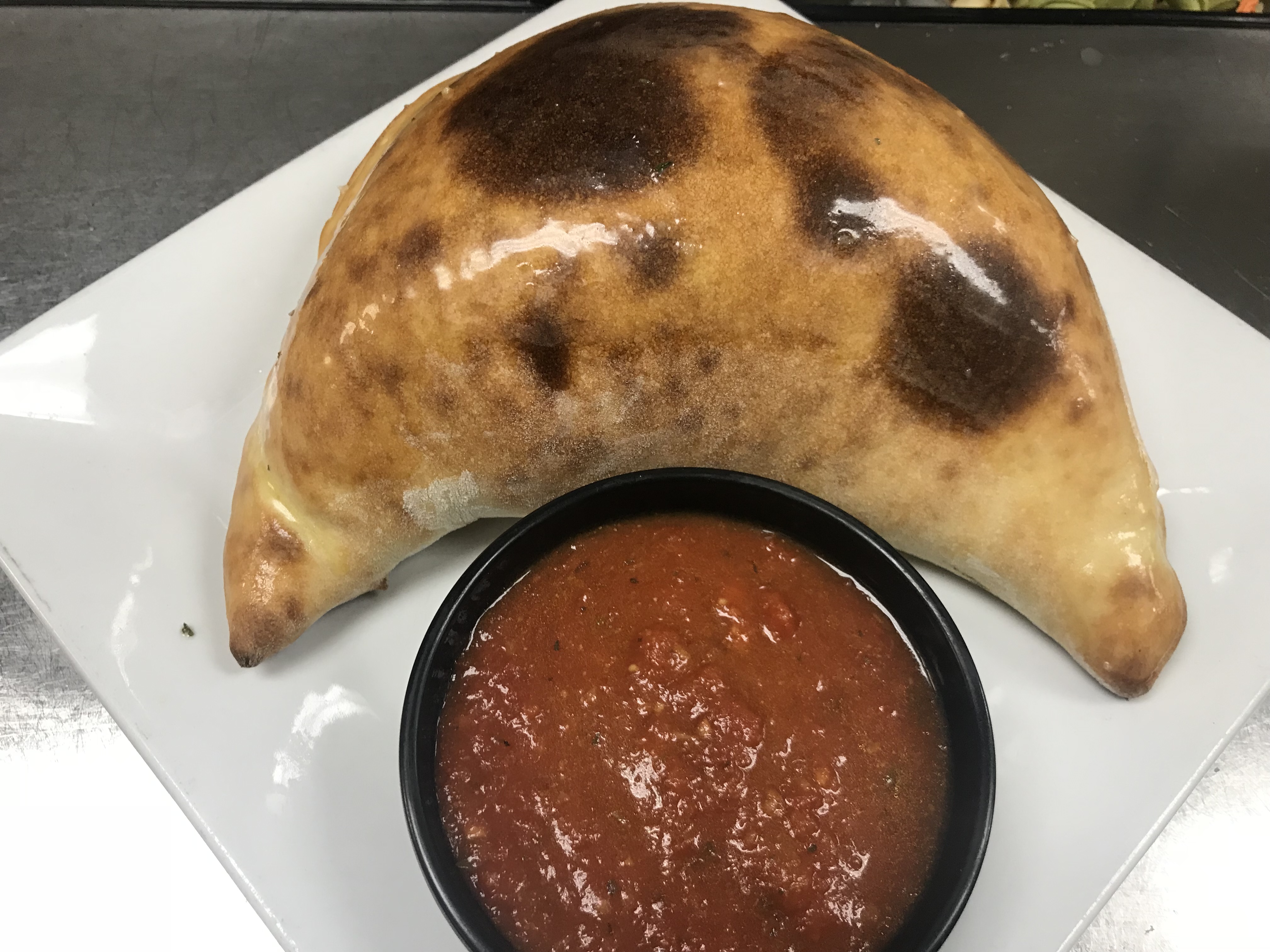 Order Spinach Calzone food online from Tuscany Italian Bistro store, Richardson on bringmethat.com