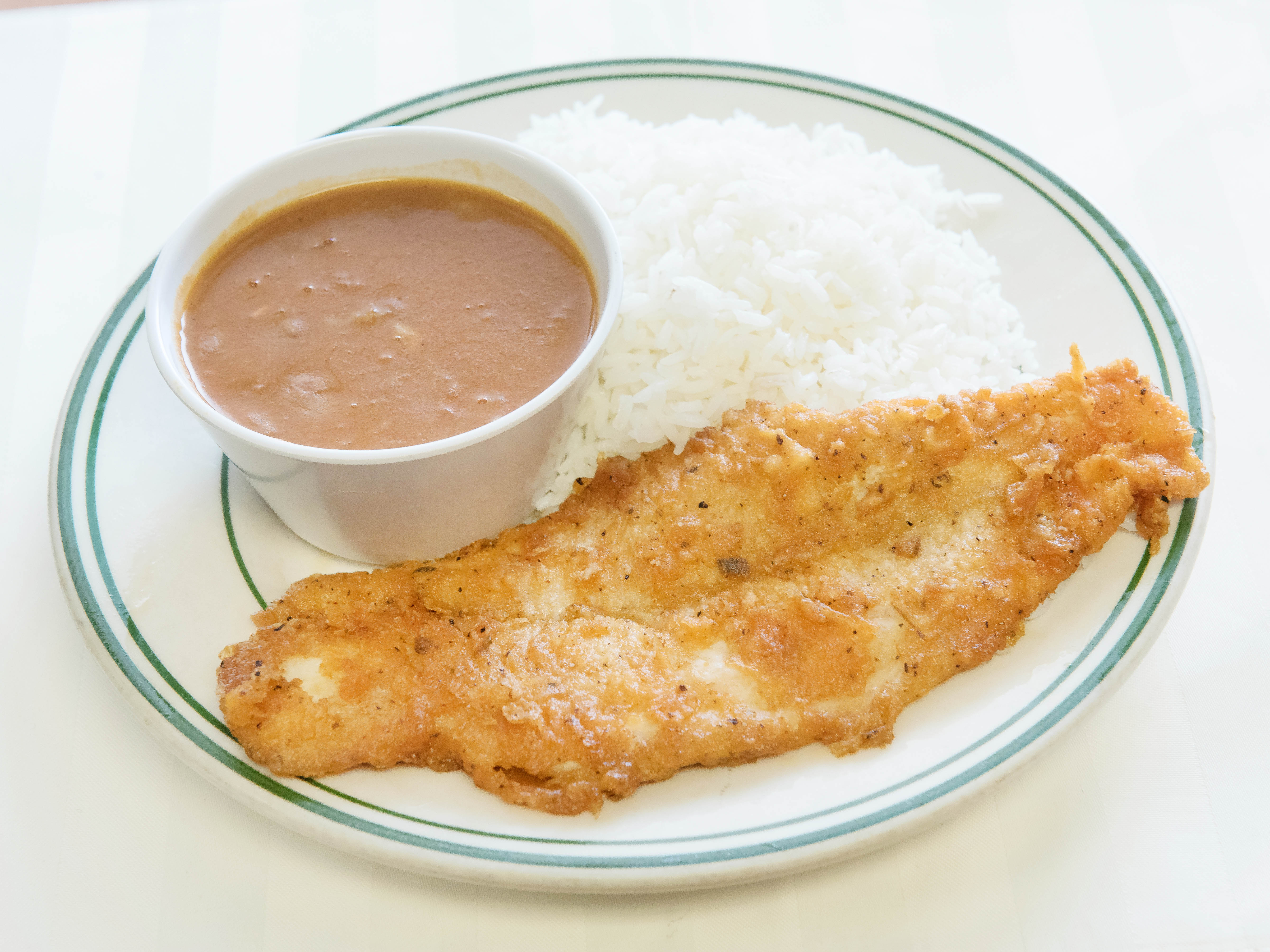 Order Lunche de Filete de Pescado  (Fried filet fish, rice, beans and choice of drink) FREE SODA OR WATER food online from los amigos restaurant store, Bronx on bringmethat.com