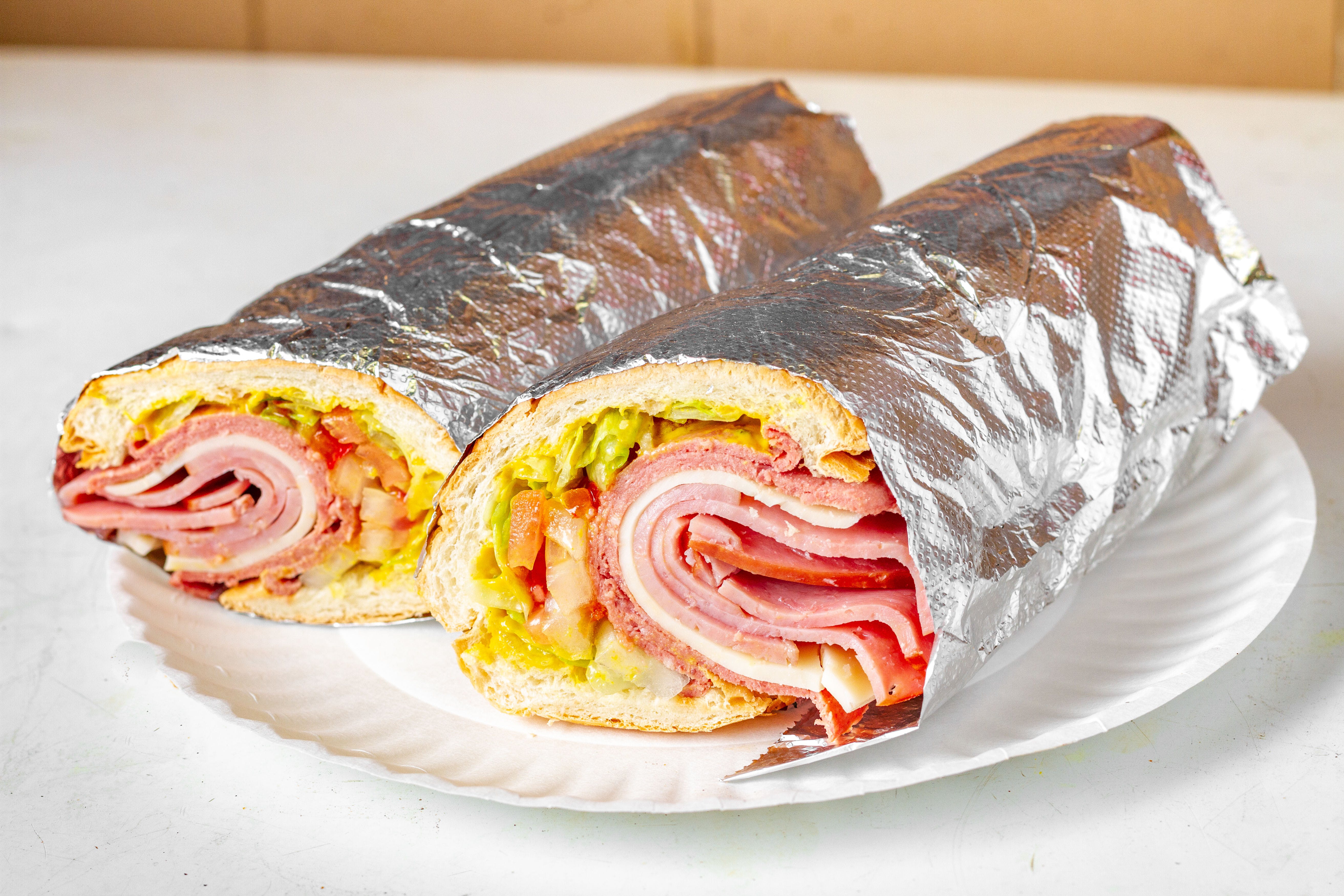 Order Italian Cold Cut Sub - Half 8'' food online from Mikie's Pizza & Subs store, Baltimore on bringmethat.com