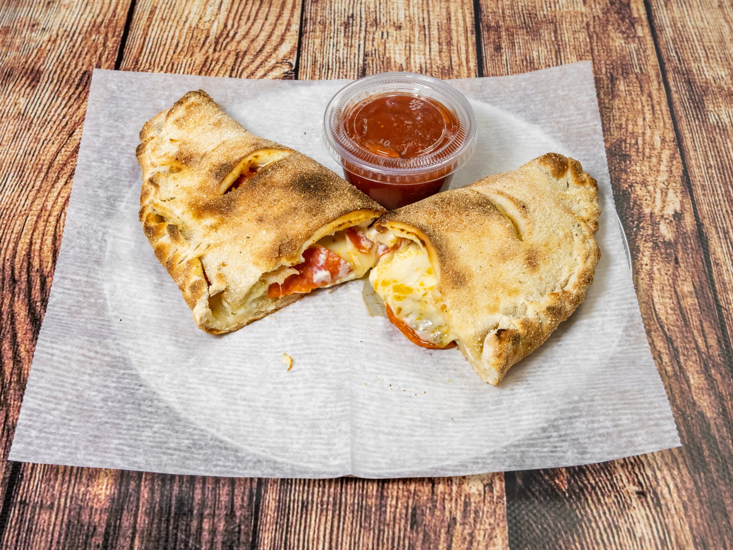 Order 1 Topping Calzone food online from Mama Z Pizzeria store, Chino Hills on bringmethat.com
