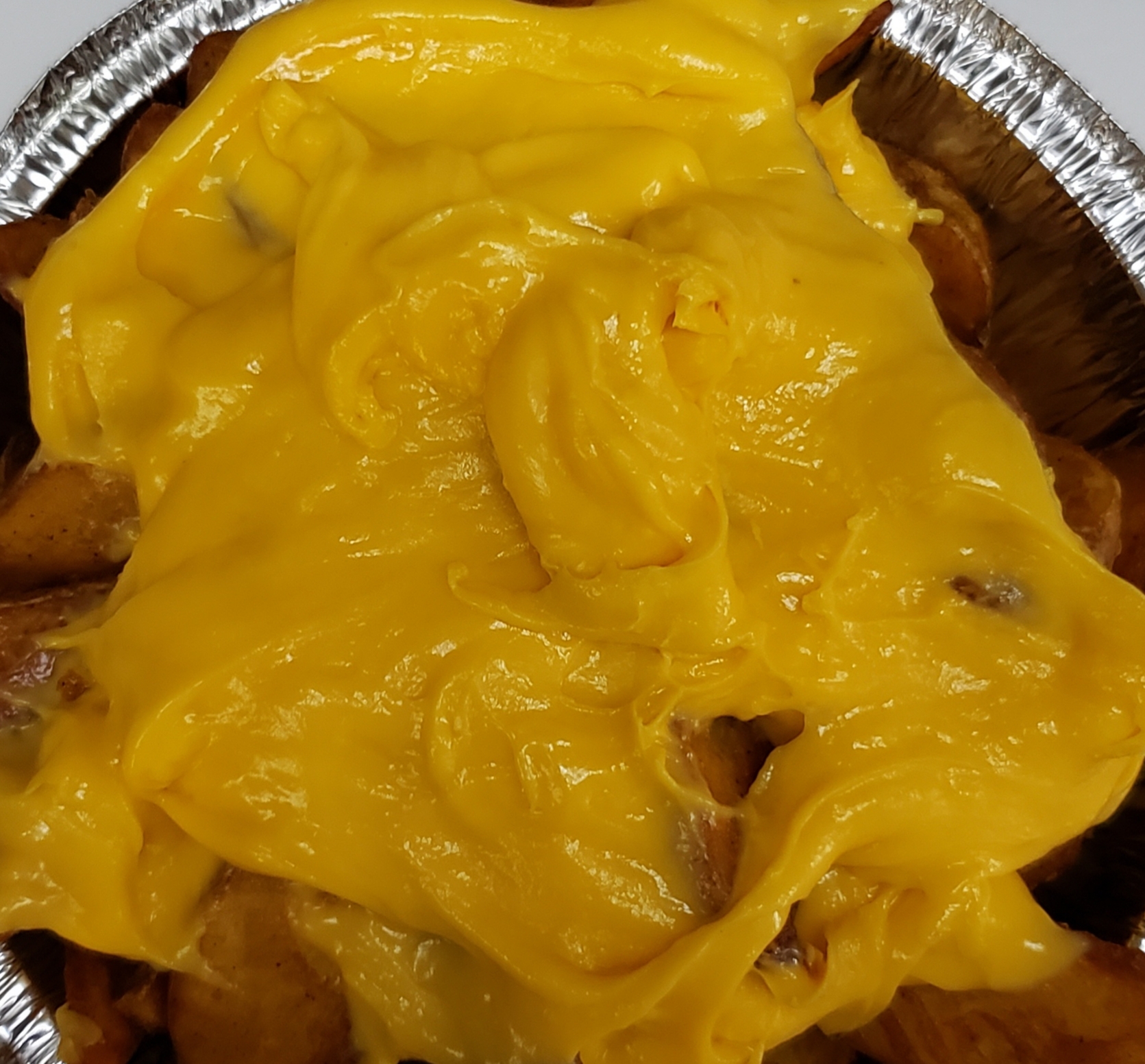 Order Western Fries with Nacho Cheese food online from Pizza Mart store, Baltimore on bringmethat.com