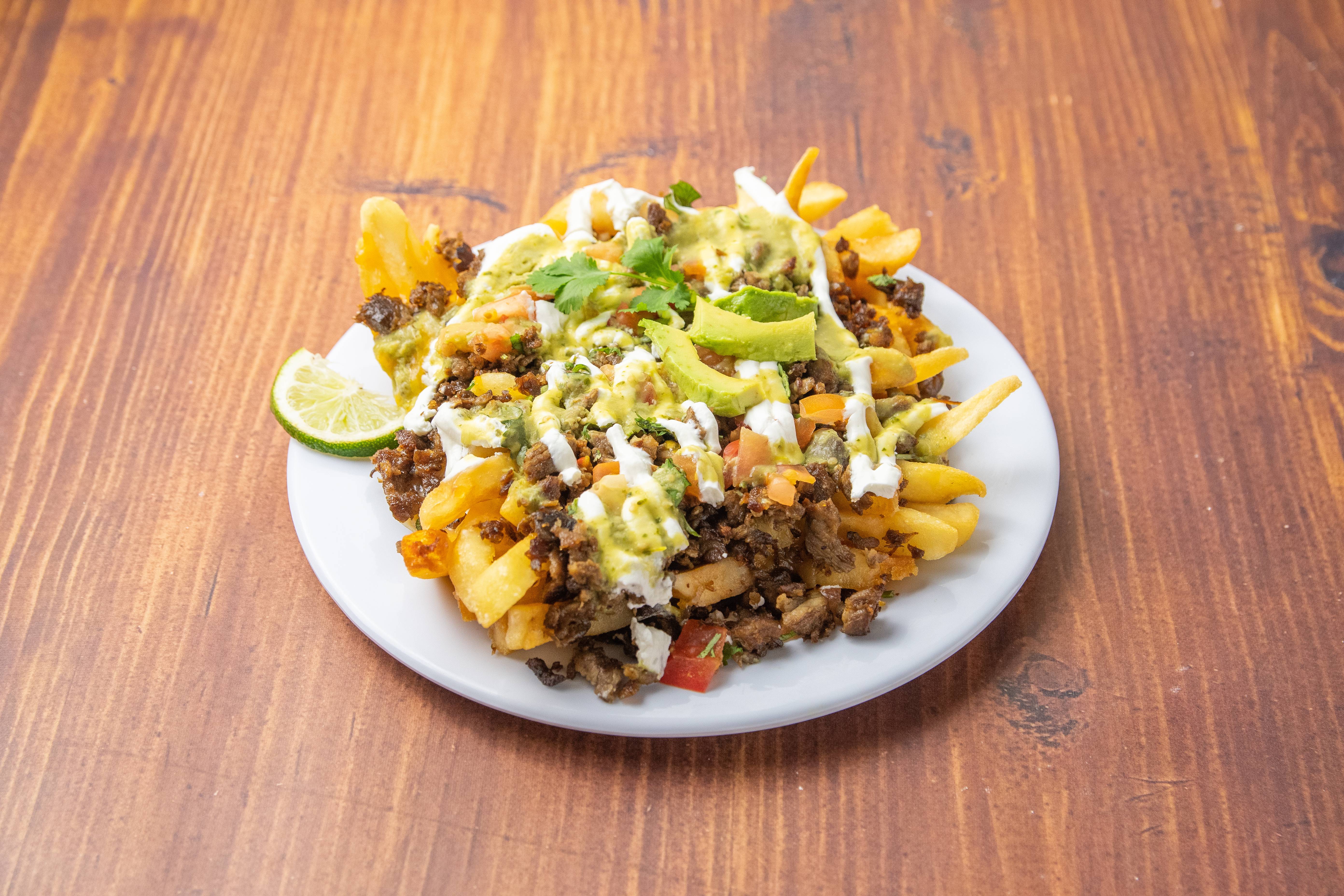 Order Carne Asada Fries food online from Taqueria Jalapenos store, Glendale on bringmethat.com
