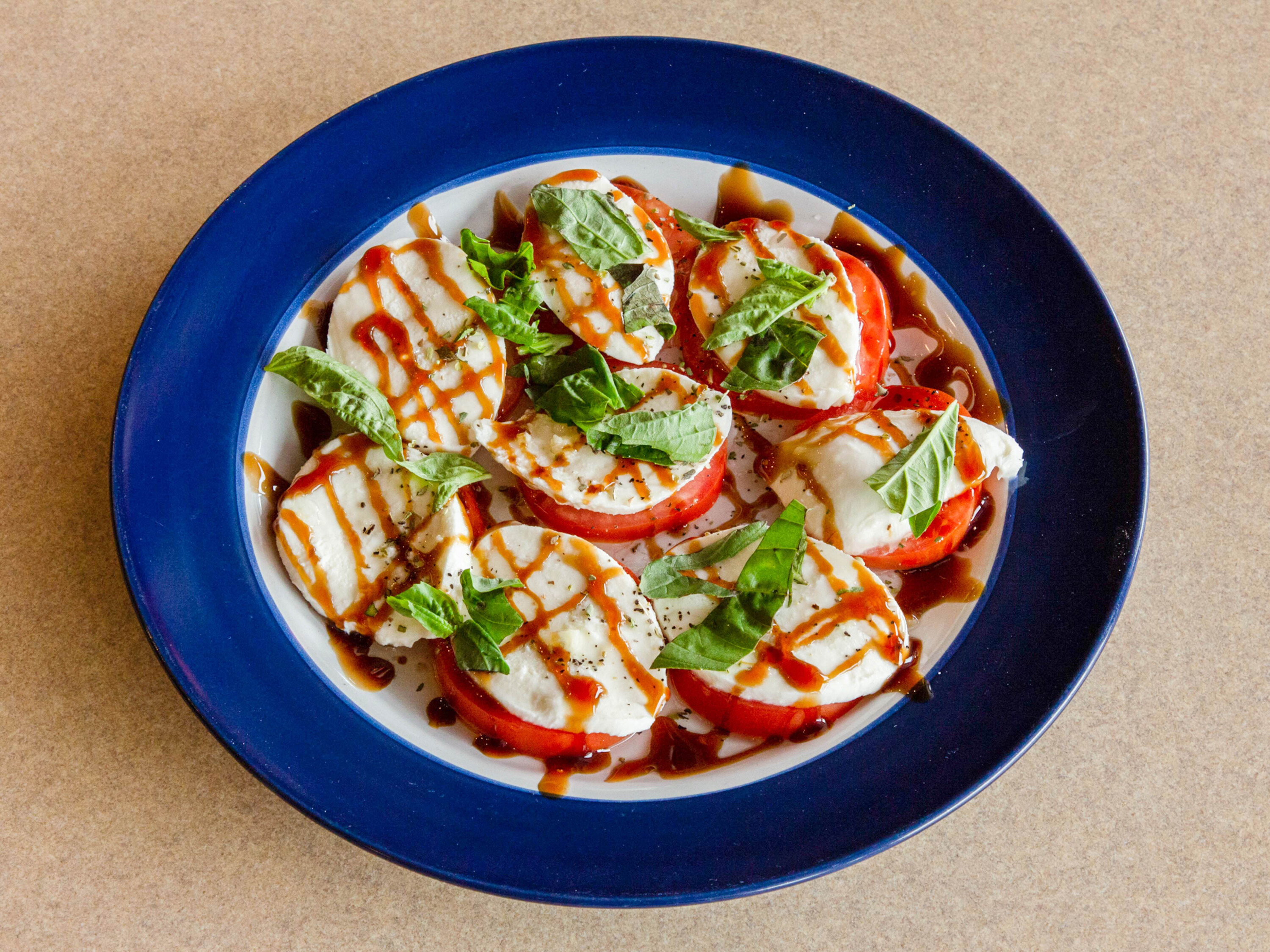 Order Mozzarella Caprese food online from Fortunato Brothers Pizza store, Edgewood on bringmethat.com