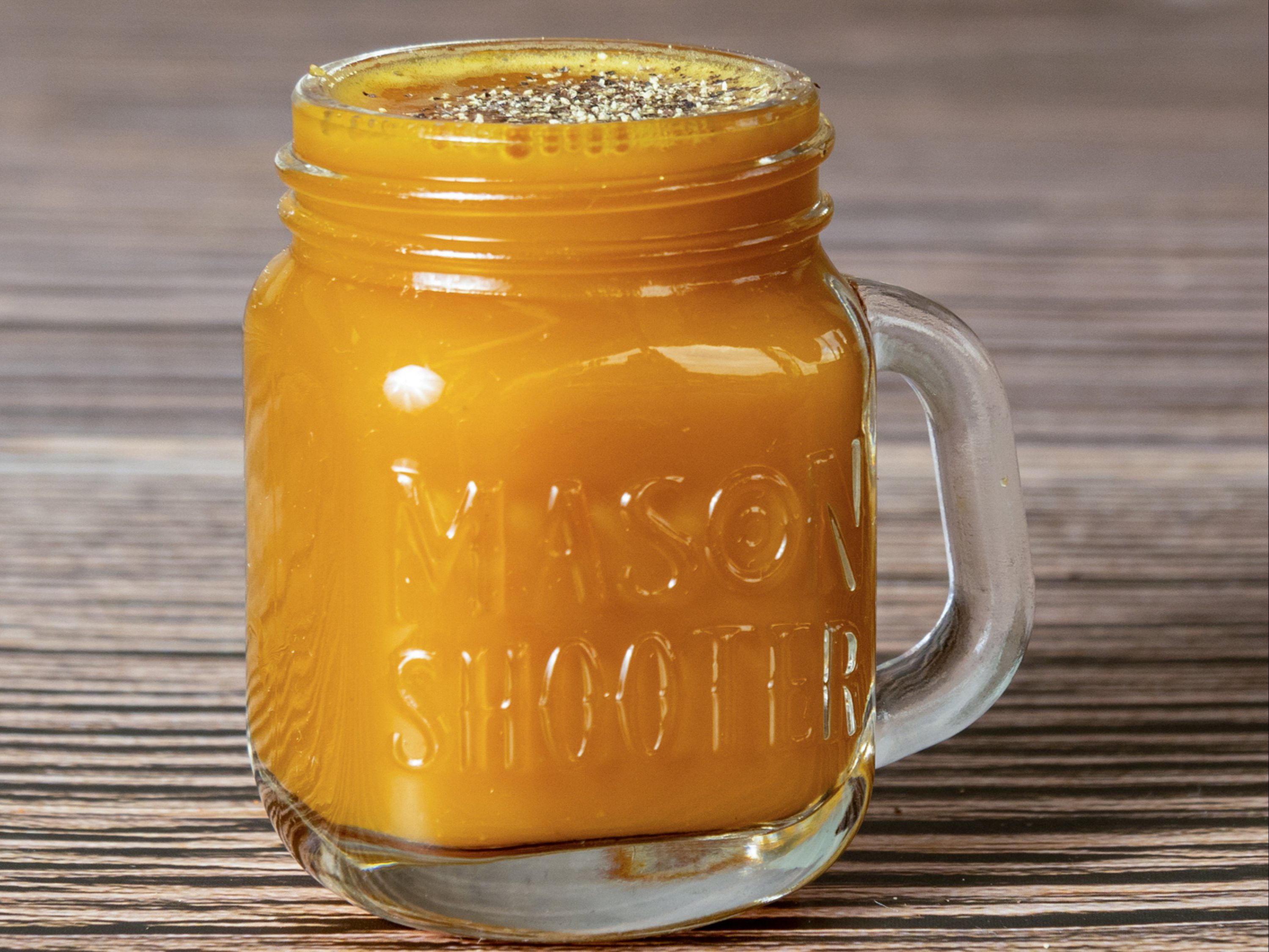 Order Turmeric Shot 2oz food online from Iget Juiced store, Snellville on bringmethat.com