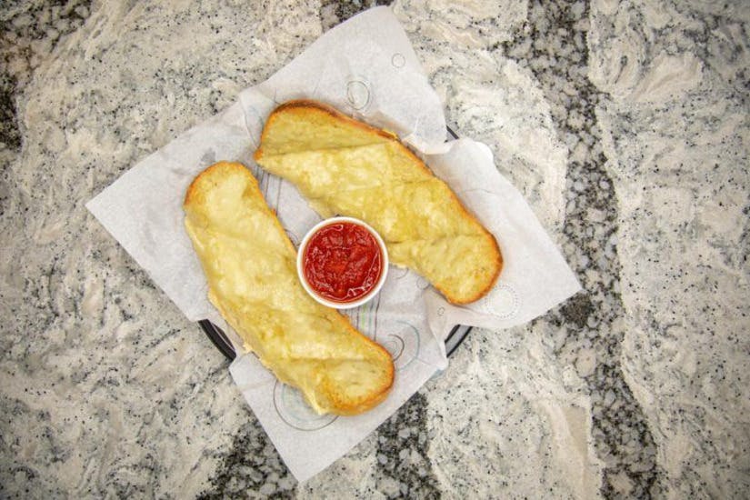 Order Loaf Garlic Bread - Appetizer food online from Topshelf Bar & Pizza store, Muskegon on bringmethat.com