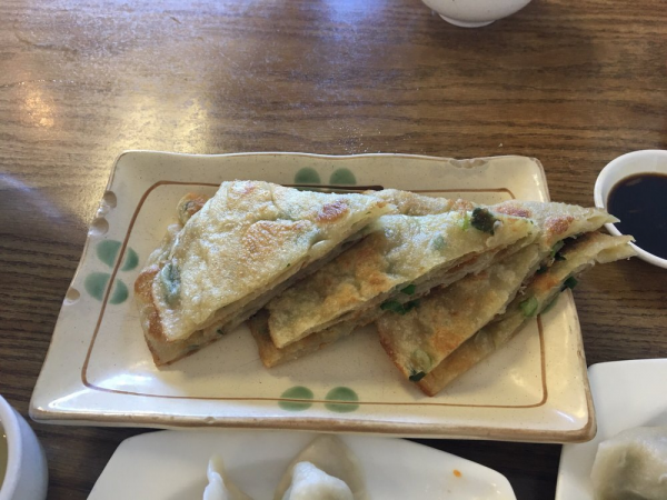 Order  葱油饼  One Green Onion Cake food online from Dumpling Empire store, South San Francisco on bringmethat.com