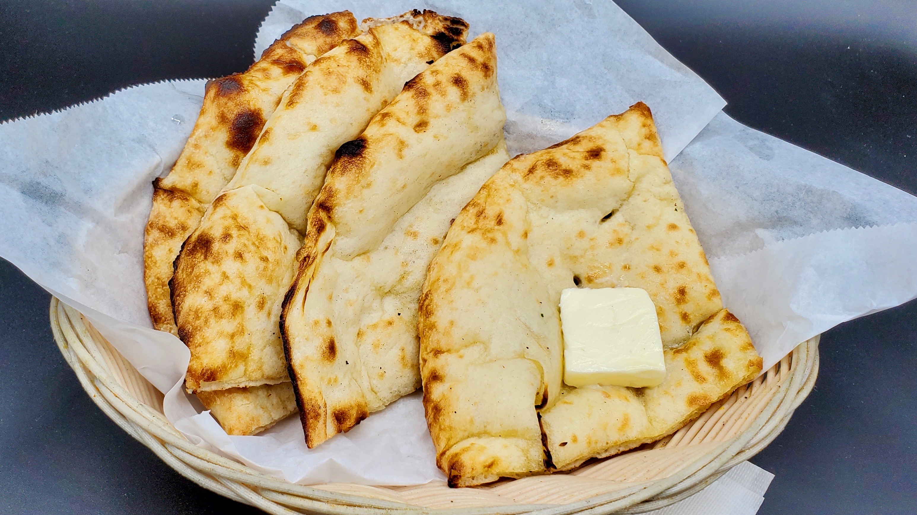 Order Butter Naan food online from Masala Desi Cafe store, Burlingame on bringmethat.com
