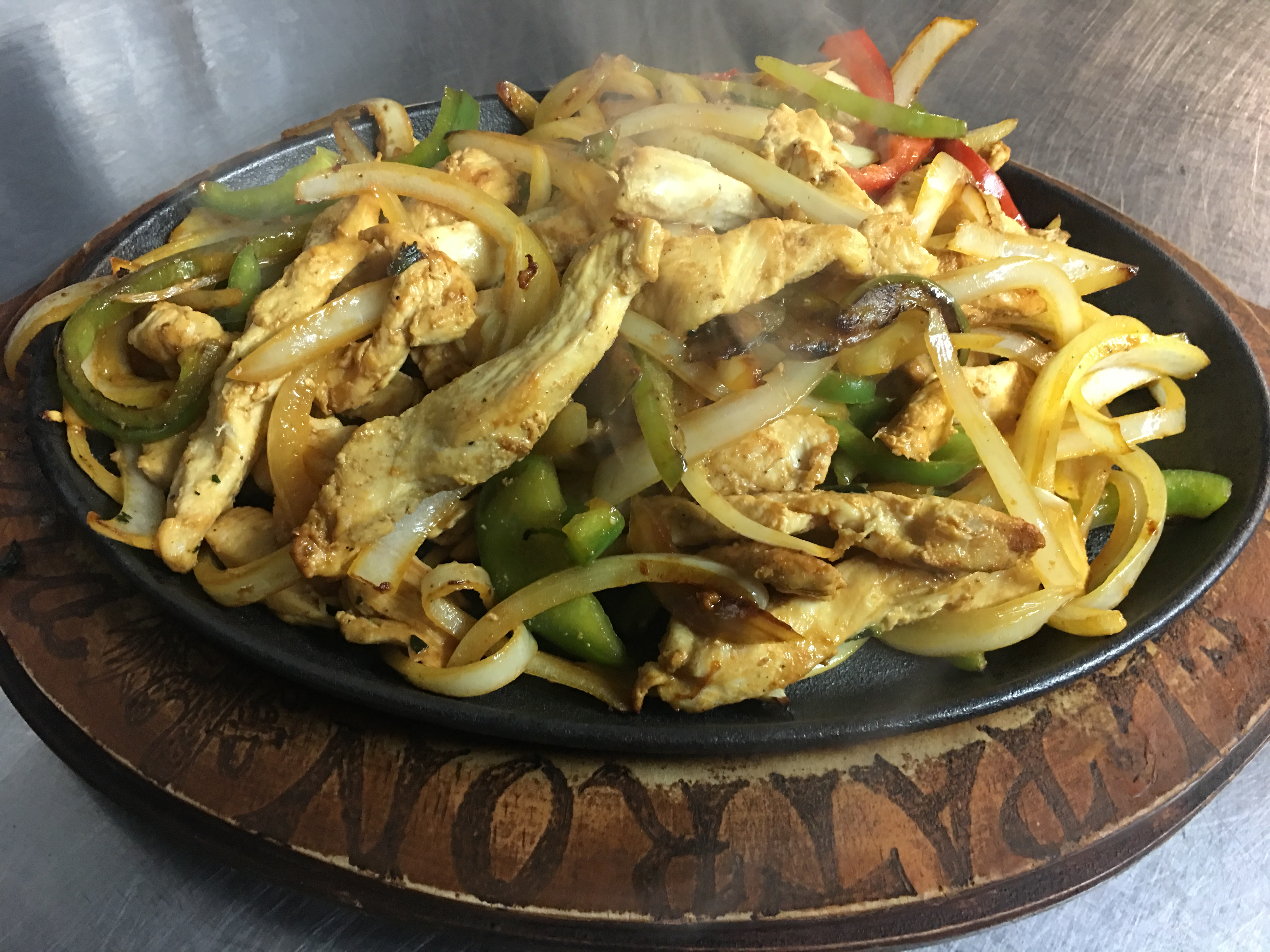 Order Chicken Sizzling Fajitas food online from El Patron Mexican Grill & Cantina store, Albany on bringmethat.com