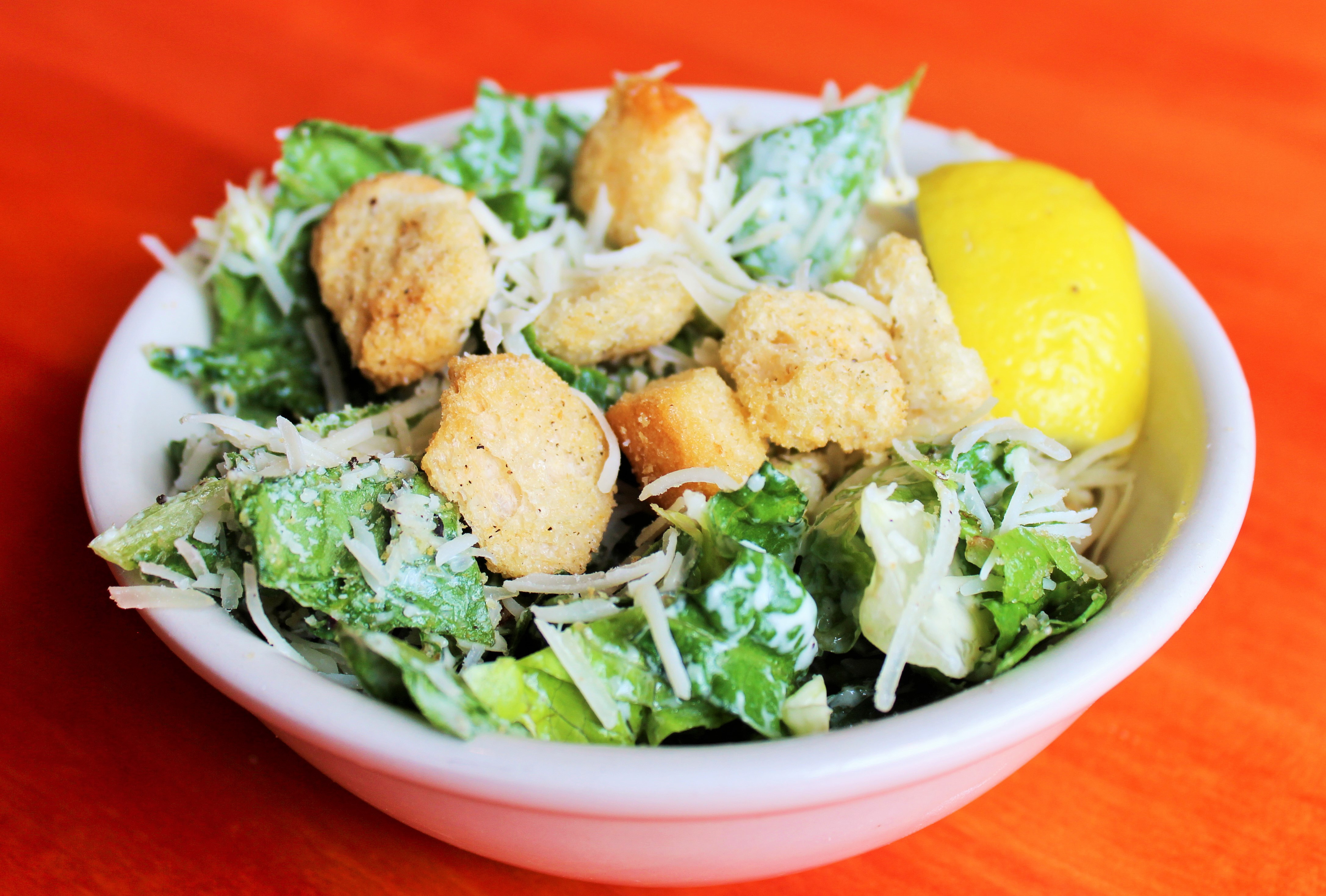 Order Caesar Salad food online from The Roman Candle Pizzeria store, Middleton on bringmethat.com