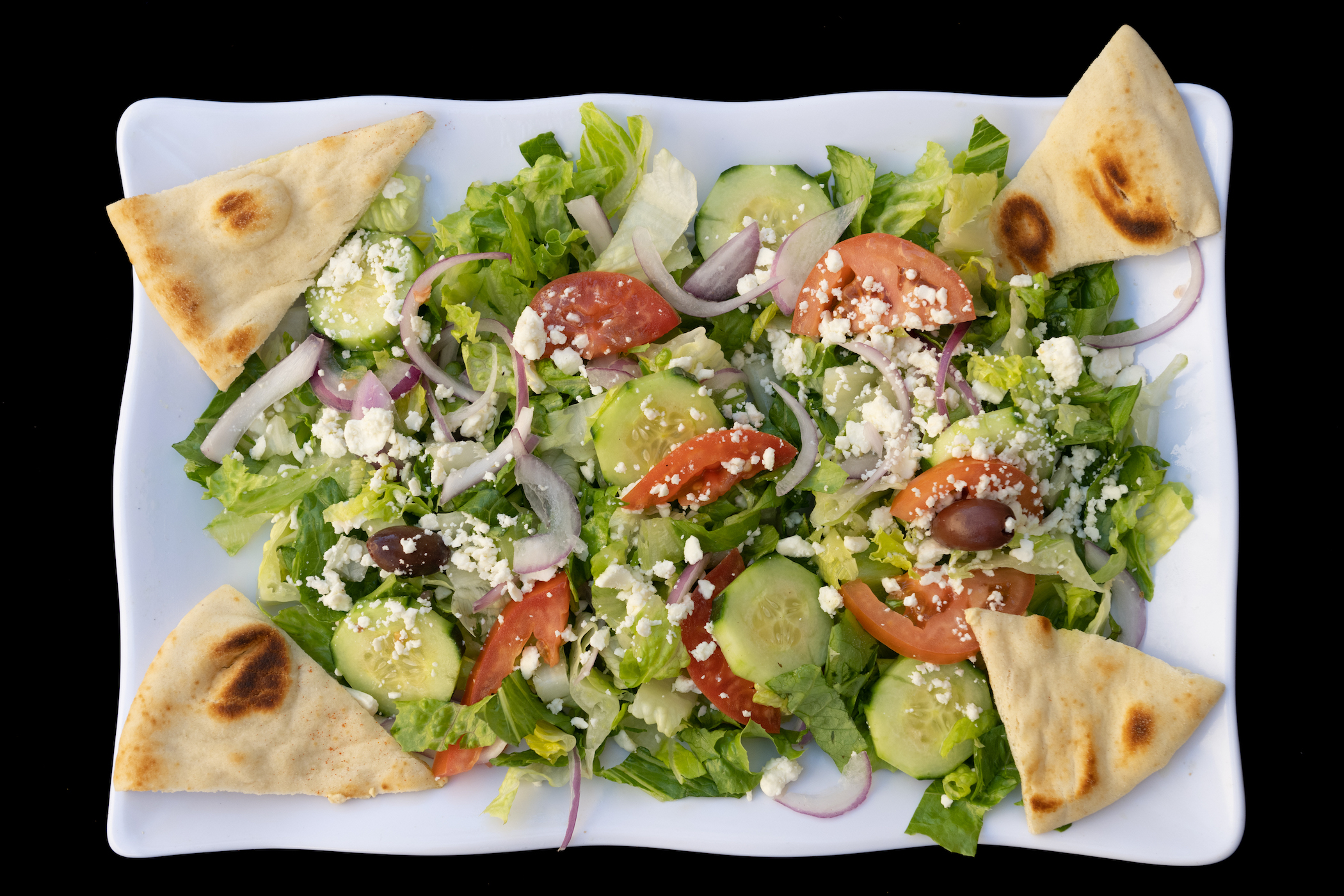 Order Greek Salad food online from Harbor Greek Cafe store, San Diego on bringmethat.com