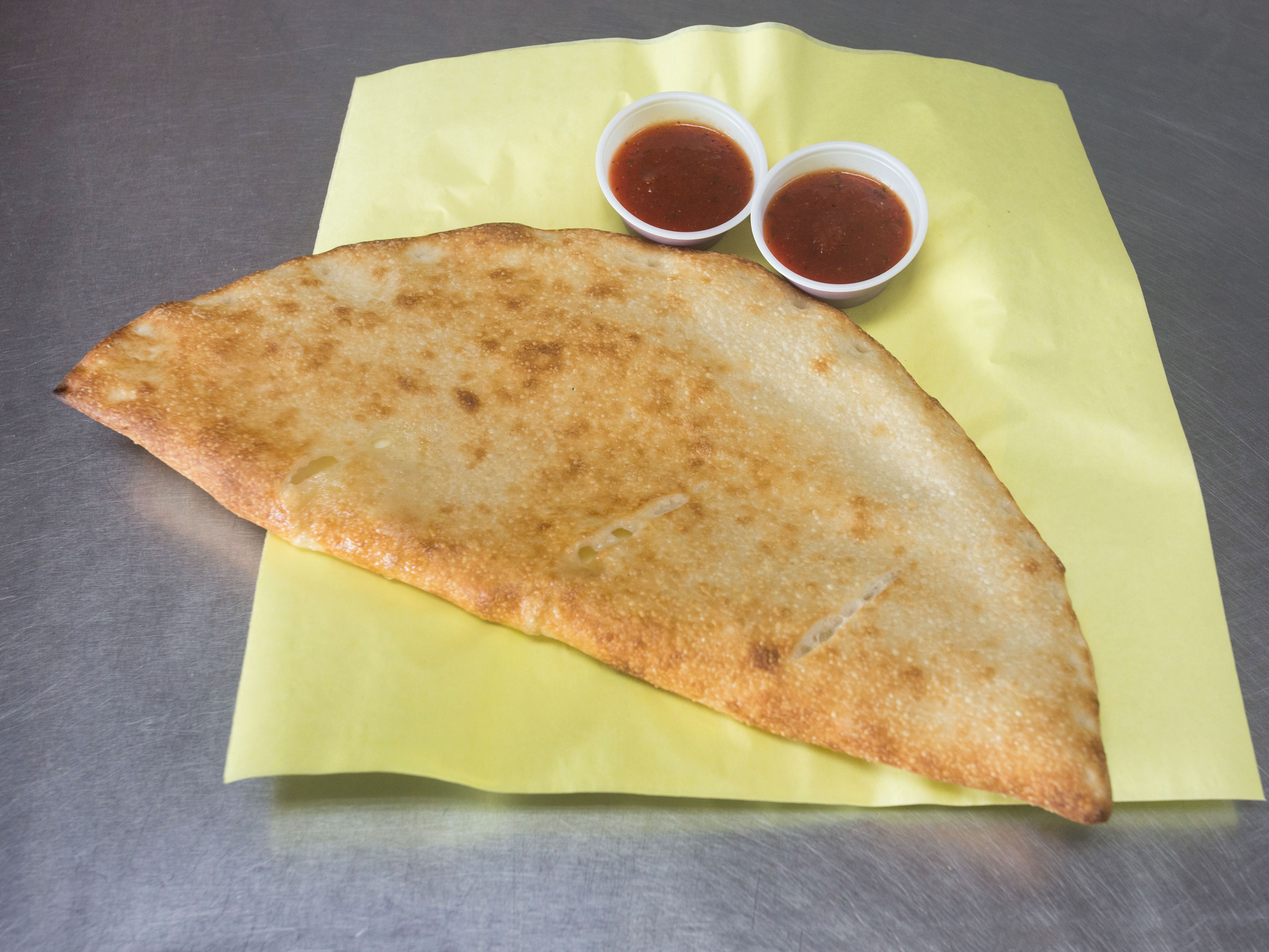 Order Spinach Calzone food online from Yaghi Pizzeria store, San Antonio on bringmethat.com