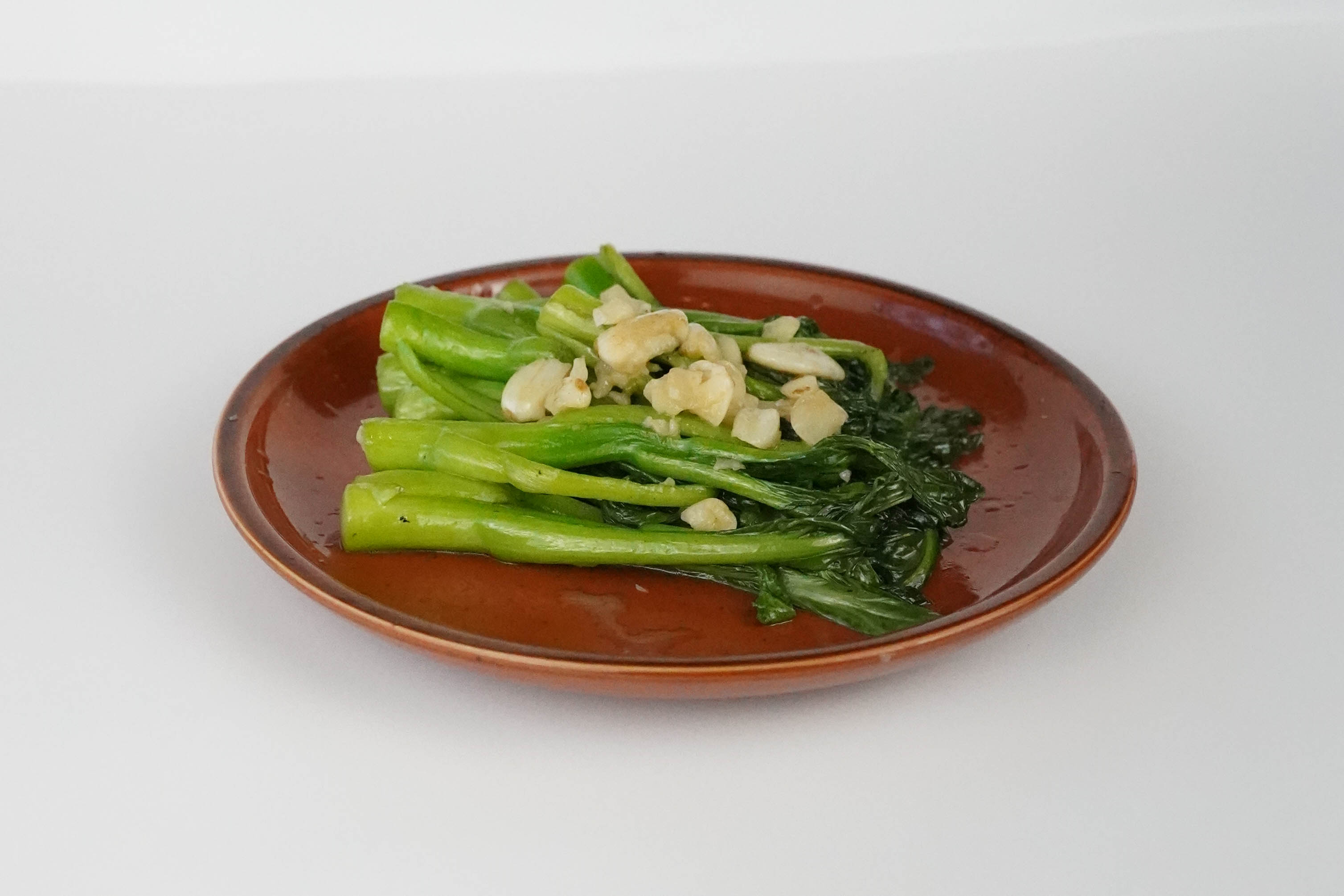 Order Stir-fry Flowering Cabbage | 蒜子生炒菜心 food online from Palette Tea Garden store, San Mateo on bringmethat.com