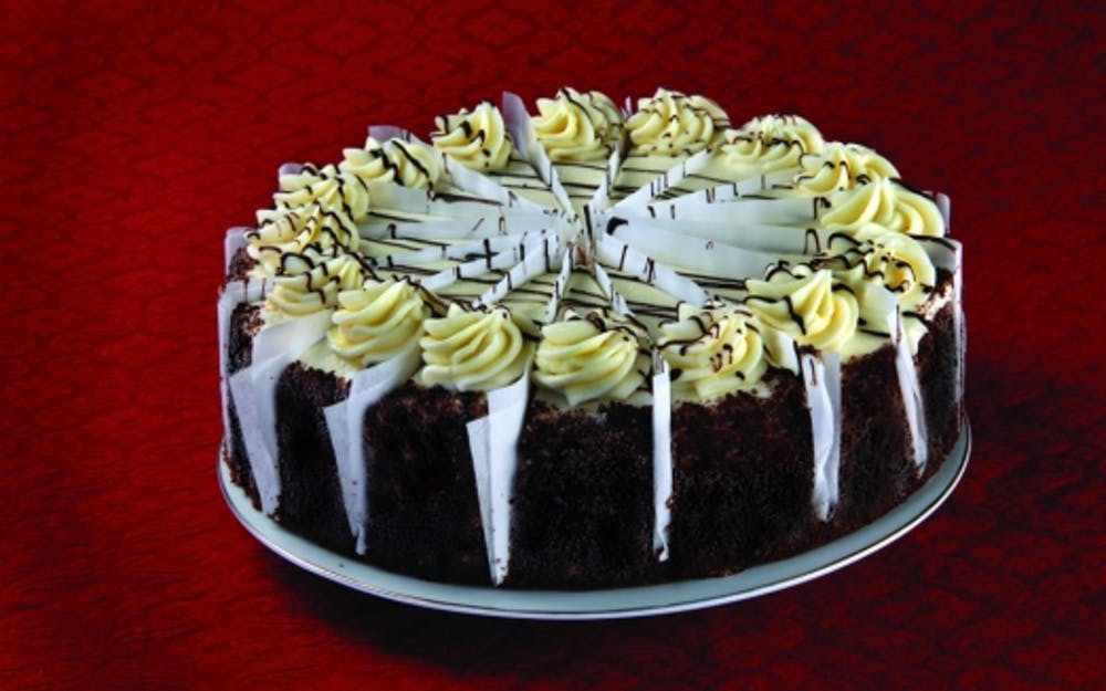 Order Red Velvet Cake - Dessert food online from Three Brothers Italian Restaurant store, Bowie on bringmethat.com