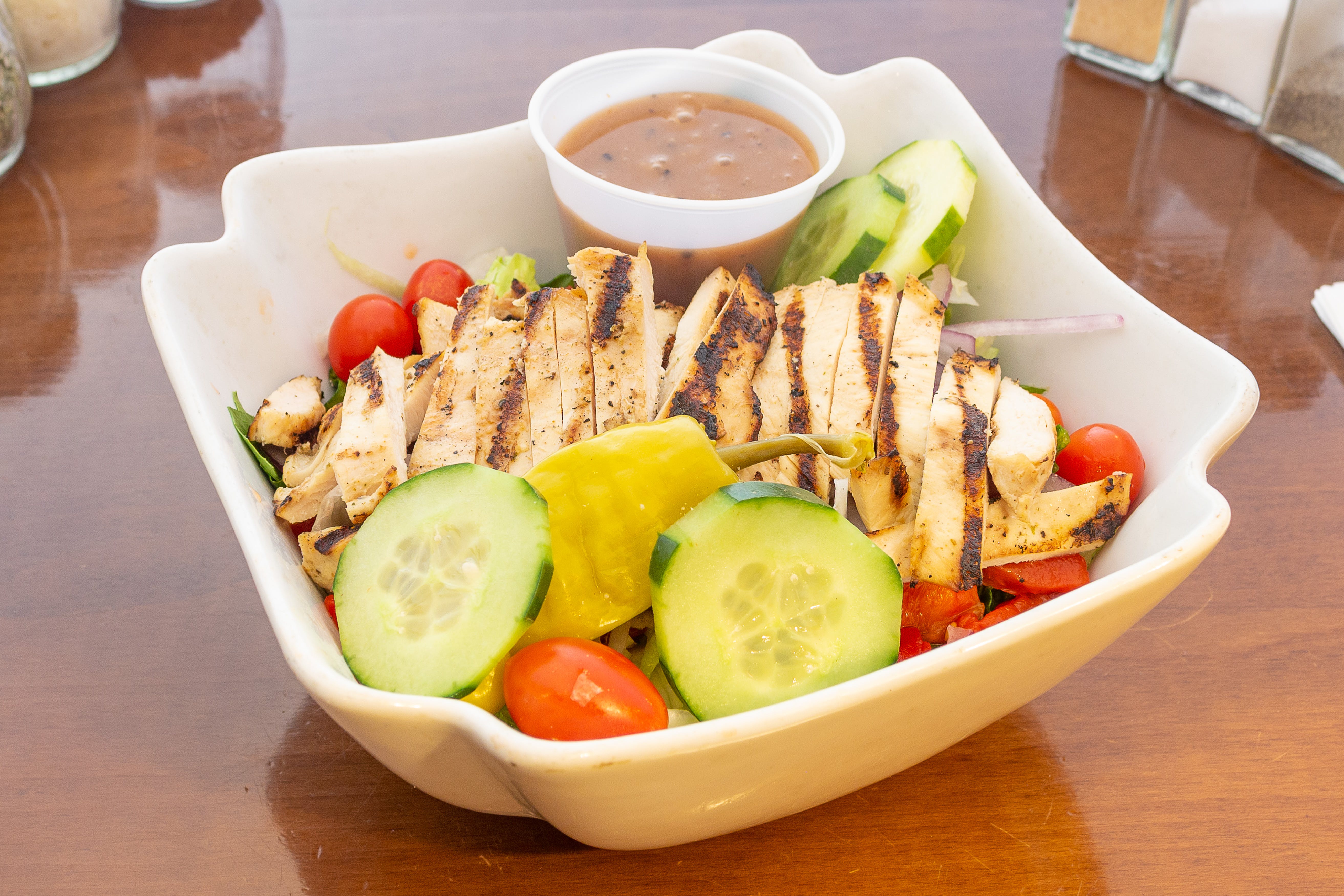 Order Grilled Chicken Salad - Salad food online from Pompilio Pizzeria & Restaurant store, Westwood on bringmethat.com