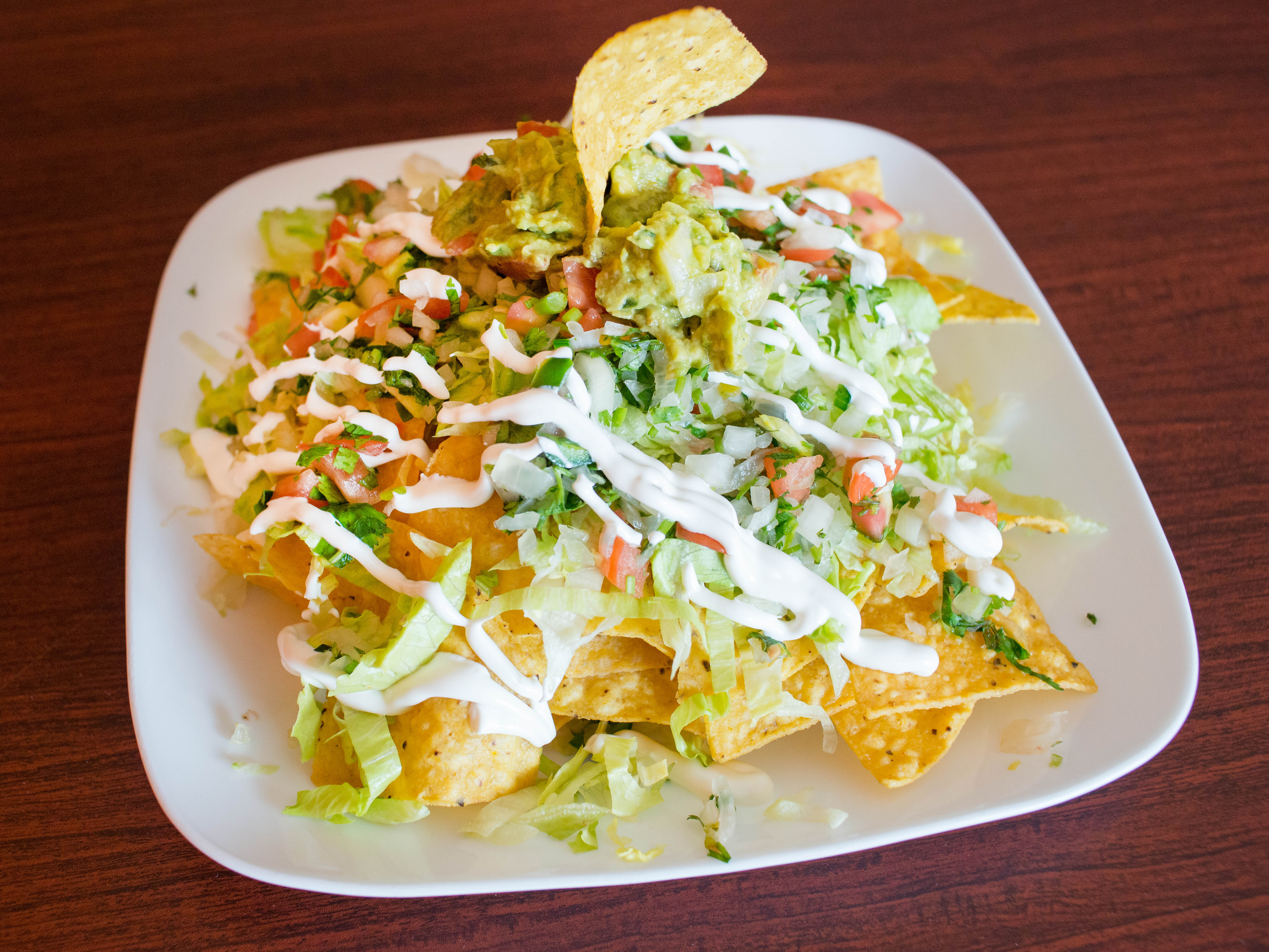 Order Nachos food online from Zocalo Bar & Grill store, Vernon Hills on bringmethat.com
