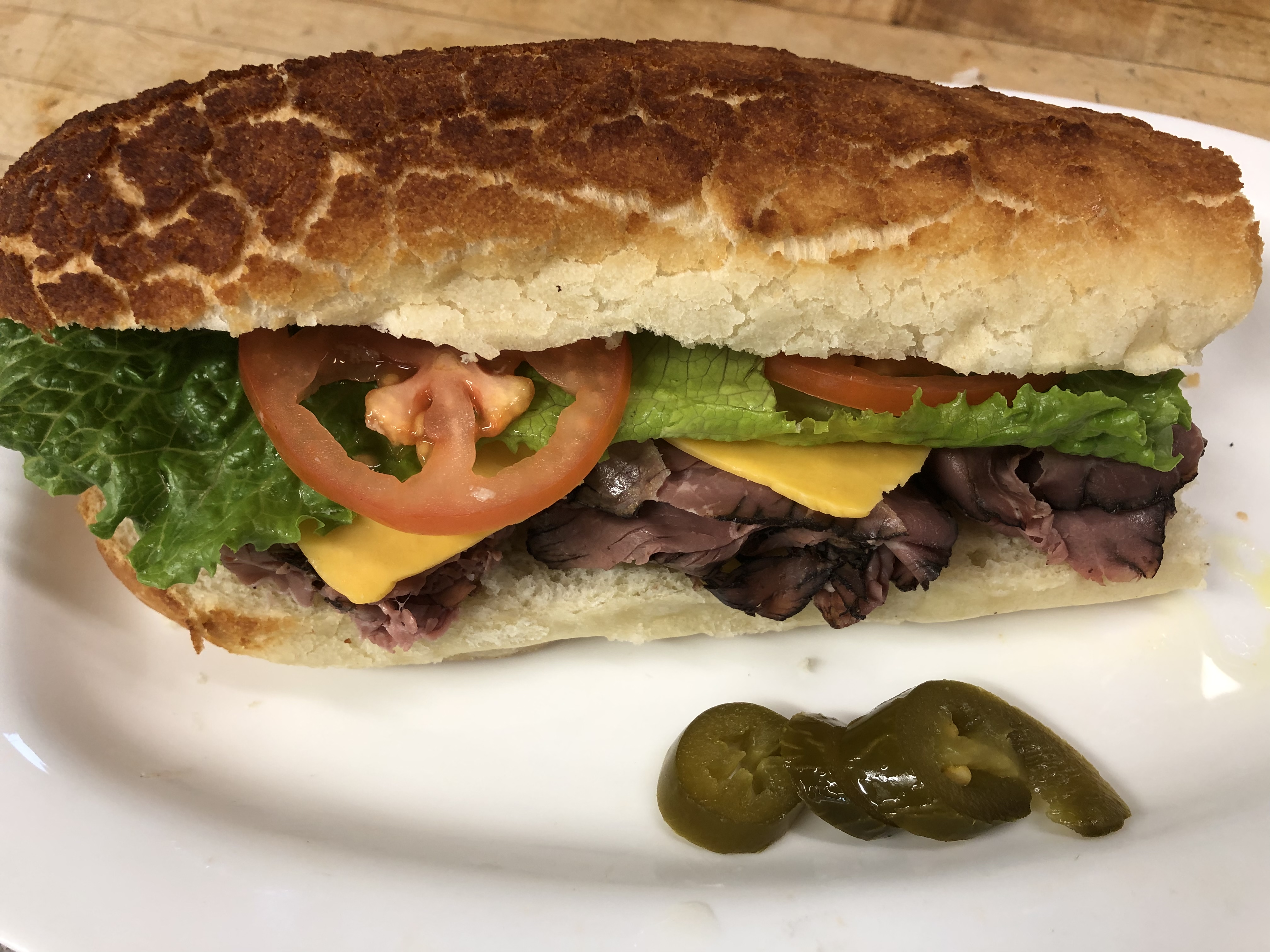 Order Hot Pastrami Sandwich with Swiss cheese  food online from Lucca Deli store, San Francisco on bringmethat.com