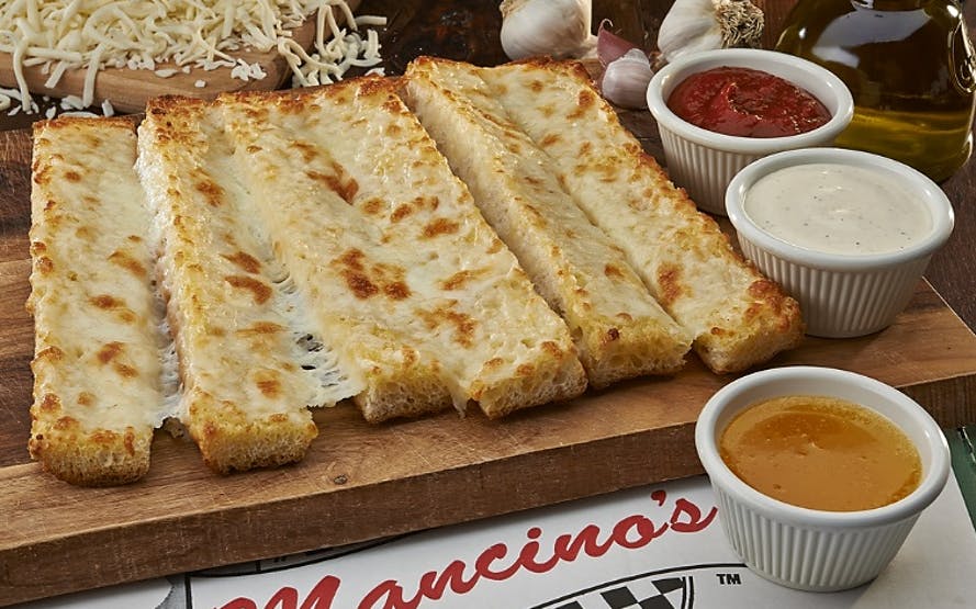 Order Garlic Cheese Bread - 1 Piece food online from Mancino Pizza & Grinders store, Fort Wayne on bringmethat.com