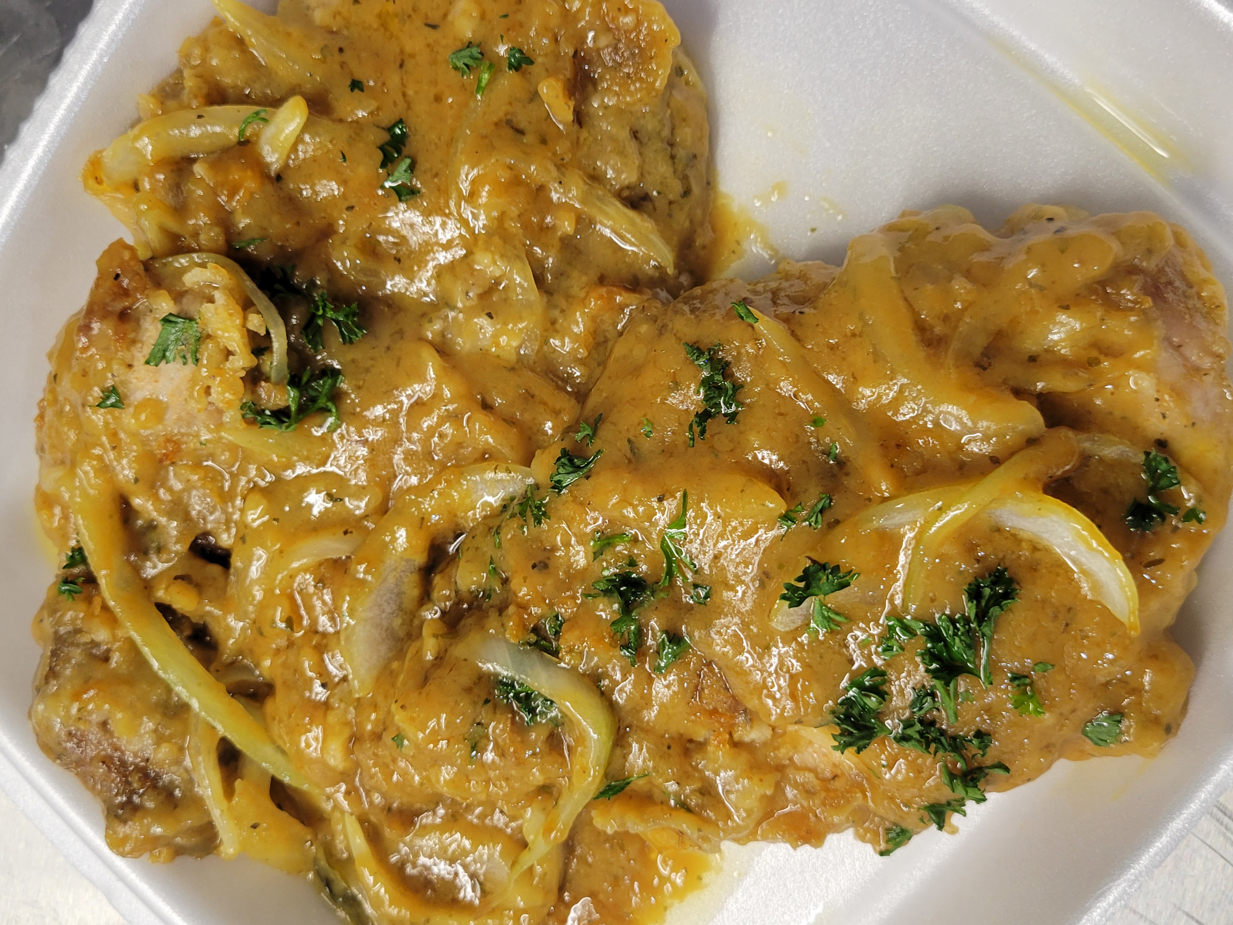Order Smothered Pork Chops food online from Soulfully Famous store, Millersville on bringmethat.com