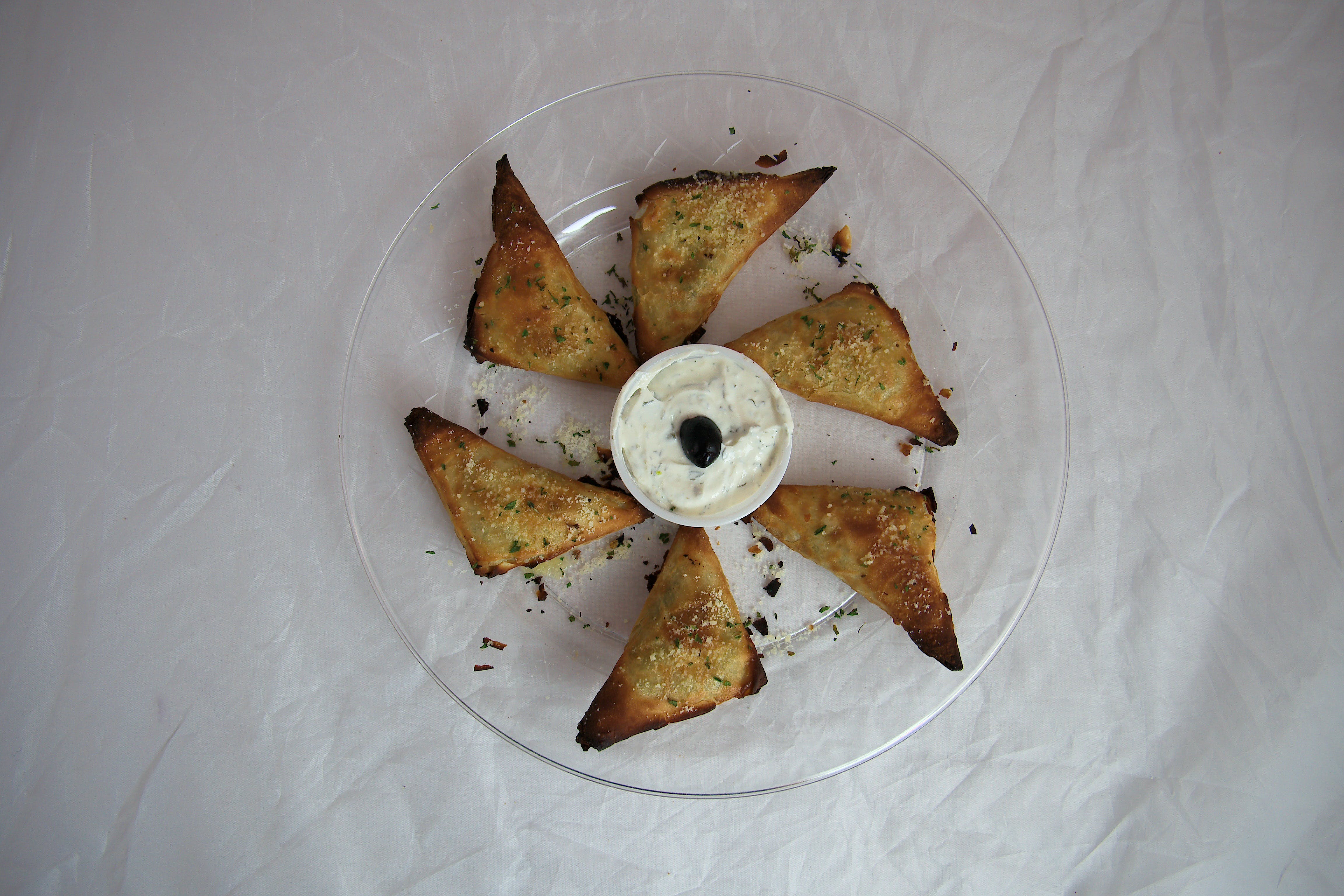 Order Spinach & Feta Triangles - Appetizer food online from Pizza Pie Me store, Arlington on bringmethat.com